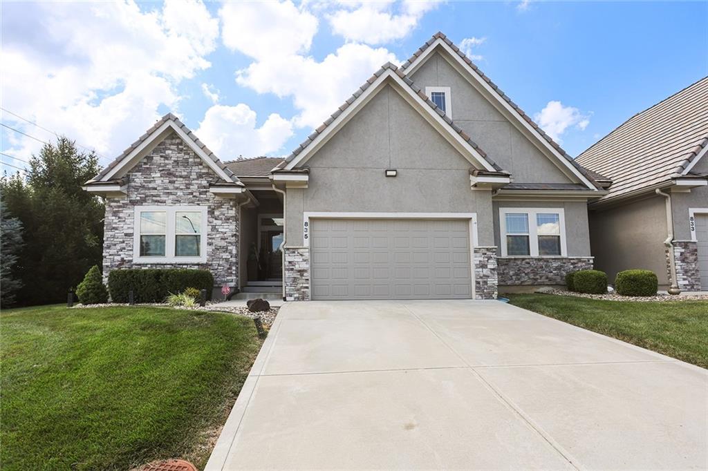 Extremely Nice & well maintained End Unit Townhome style property! Very quick access off the Highway, easy & quick to stores, shops too! Super quiet inside, nearly zero noise outside with peace, serenity abounds sitting on the covered deck! This Beautiful custom built maintenance free ranch with all the amenities Lakewood has to offer! Large open floor plan perfect for entertaining. Large Master Suite has a huge walk-in closet, double sink vanity and walk in shower! Finished Lower Level, family Room, Kitchenette with Guest Bedroom, Guest Bathroom, and has Tons of Storage! 2 full areas on the lower level! Attached 2 car garage makes this super nice walking right into the kitchen! Come & Show this unique, beautiful home today!