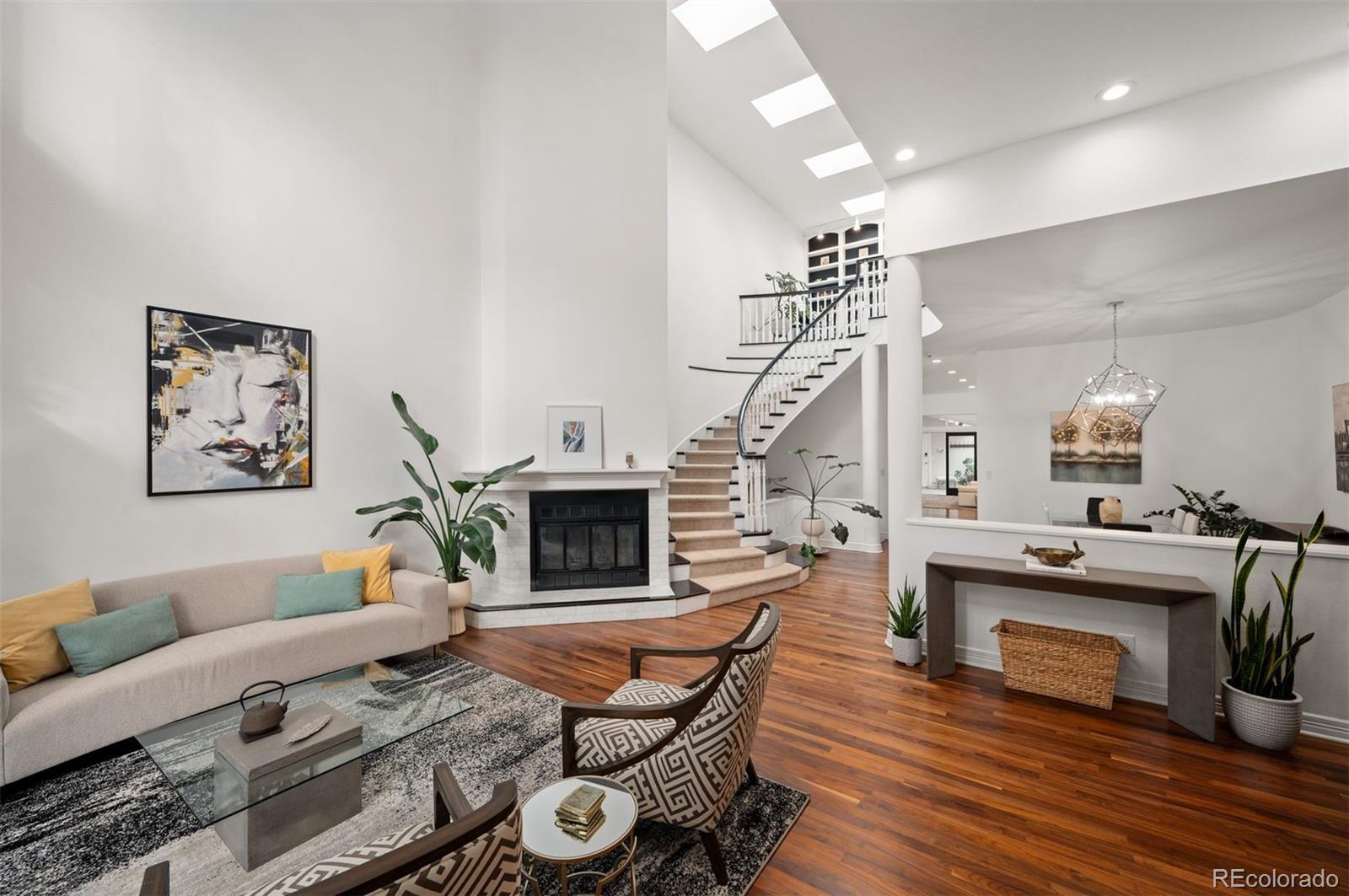 Rare opportunity to own one of the most natural light-filled townhomes on a premier Cherry North Creek block just steps from Denver’s best dining, shopping, and fitness studios. This expansive west-facing executive residence blends timeless architecture with over $225,000 in curated upgrades, offering refined lock-and-leave living in one of Denver’s most walkable neighborhoods. The dramatic central staircase and rich walnut floors anchor the main level, designed for both elevated entertaining and everyday comfort. The chef’s kitchen features Sub-Zero and Fisher & Paykel appliances, dual microwave and wall oven, Silestone surfaces, and floor-to-ceiling cabinetry seamlessly flowing into a spacious family room with gas fireplace, adjacent 4-season atrium and interior courtyard.Upstairs, the primary suite is a true retreat with dual customized walk-in closets and a spa-inspired five-piece bath. French doors lead to a private rooftop deck with a firepit. A guest bedroom with ensuite provides comfort and scenic mountain views.The professionally finished lower level offers a media room, ample storage, spacious third bedroom with walk-in closet, and beautifully appointed dry bar with Taj Mahal quartzite countertop & Sub-Zero beverage fridge; Extended living space ideal for movie nights, guests & home office.Significant recent enhancements: Andersen windows and doors, custom shades, radiant heated atrium flooring, smart Lutron lighting, whole-house steam humidifier and resealed skylights, while extensive HOA improvements include new roof coating and exterior refresh. The deep two-car garage is fully finished with epoxy flooring, custom cabinetry, EV-ready outlet, and Wi-Fi-enabled garage door opener.A rare combination of natural light, mountain views, and premier location makes this turnkey home one of Cherry Creek North’s most compelling offerings.