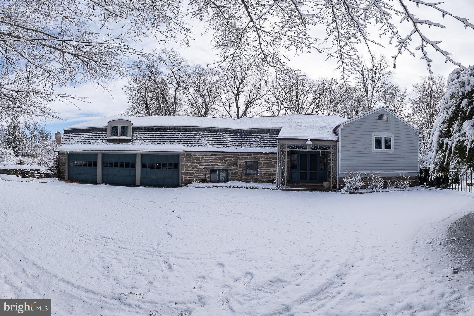 Welcome to your dream home nestled on one of the most sought-after cul-de-sac streets in Lower Merion Twp, just a short stroll from Suburban Square, Haverford Square, the train to Center City and Merion Cricket Club. This stunning sanctuary in Northside Haverford features five spacious bedrooms and four full baths along with an additional two half baths, expertly reconfigured and tastefully modernized for today’s lifestyle. The sunny custom kitchen includes streamlined Porcelanosa cabinetry and tile flooring, and is anchored by an oversized Krion topped island. Bosch appliances include double ovens and an induction stovetop, a wine refrigerator and Miele dishwasher. A cozy family room with a dual sided fireplace offers two seating areas to enjoy the cozy fire on winter days. The entire rear of the house walks out to a beautiful expanded flagstone patio perfect for entertaining and al fresco dining while overlooking scenic valley views. The formal dining room is adjacent to the kitchen and has folding doors that can be closed to offer a more intimate setting or open to create a more casual experience. The spacious living room has a fireplace offering aesthetic appeal with beautiful built-in designs against a backdrop of stunning natural views as well as views of the pool. A first floor office /sunroom which also leads to the flagstone patio makes a wonderful place to work or relax. Upstairs find the luxurious primary suite with a spa like soaking tub and walk in shower, dual sinks and two walls of custom built cabinetry providing ample closet storage. Enjoy a cup of coffee or glass of wine off your own private primary balcony and oversee the beautiful landscape. A second ensuite bedroom offers a walk-in shower. Two additional bedrooms complete the second floor with a Jack and Jill bathroom. A separate linen room offers a laundry chute and provides access to the third floor, which makes a perfect au pair/guest suite/gym/second office with two additional rooms as well as a full bathroom. This suite can also be accessed directly from the back stairs that lead down to the garage so as to maintain its privacy. Radiant heat in the family room and mud room entry, an abundance of storage space, 3 car garage, newer heated pool, all in Lower Merion School District this move-in ready home offers a perfect blend of modern amenities and classic charm, set in a fabulous neighborhood that prioritizes lifestyle and convenience. You’re just steps away from restaurants, shopping, the train and recreational activities, making it an ideal setting for both relaxation and entertainment. A rare chance to move into this exceptional neighborhood and enjoy this beautiful sanctuary, where every detail has been thoughtfully crafted.