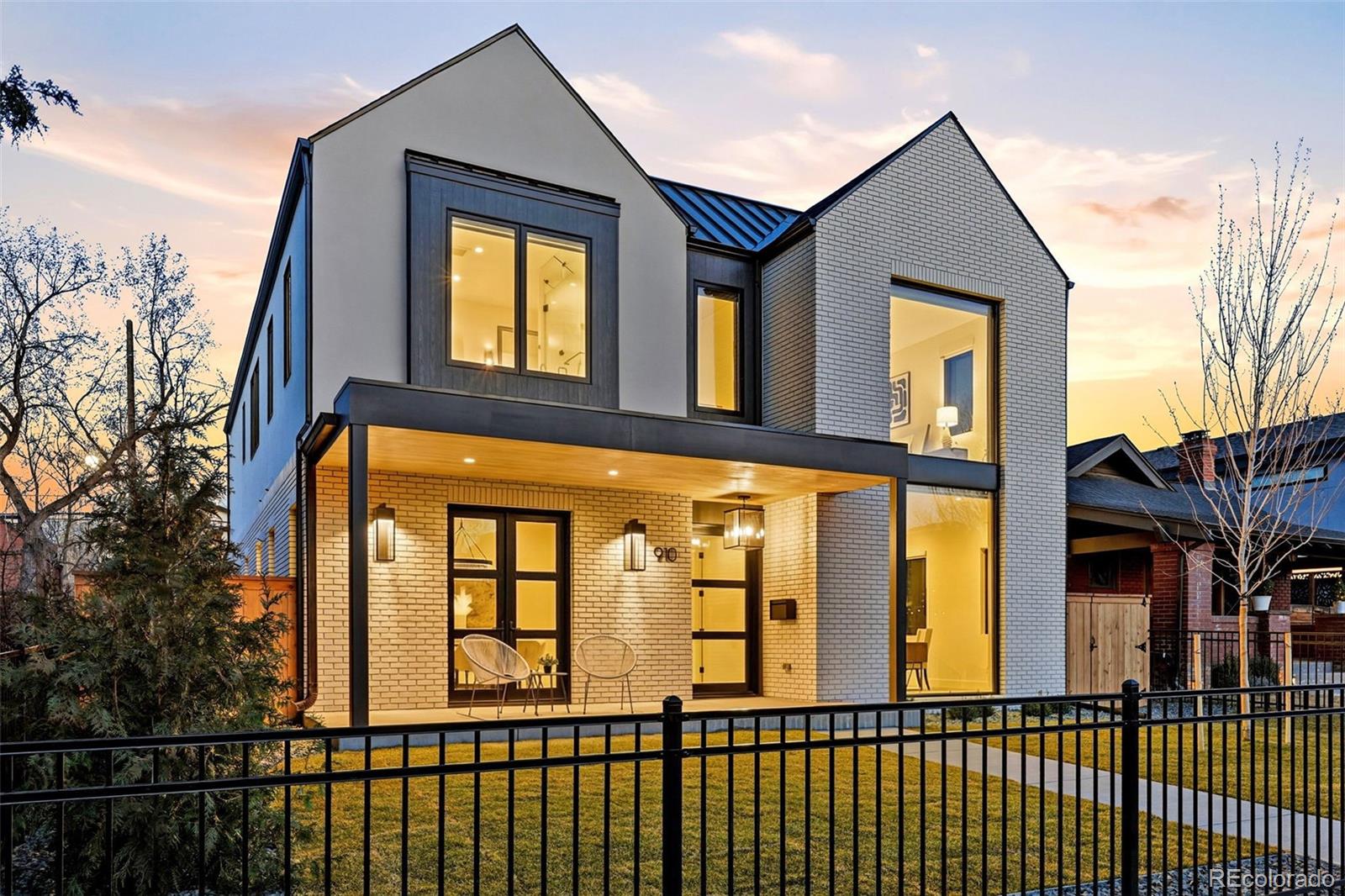 Discover this brand-new luxury residence offering more than 5,400 SF of elevated urban living in a coveted Wash Park location! This modern architectural statement showcases refined design, advanced tech, and wellness-driven construction, all in one of Denver’s most prestigious neighborhoods. Indoor Air Plus Certified, the home is engineered for superior comfort and efficiency. An advanced ERV system refreshes interior air every 45 minutes, 2 HVAC systems with 4 independent zones, whole-home humidification system, sound-insulated bedroom/bath walls, and hot water recirculation. The main level was curated for seamless indoor-outdoor living. A dramatic 16-foot sliding glass wall opens to the covered patio, while a floor-to-ceiling fireplace anchors the great room.The chef’s kitchen is sculptural and functional, featuring Vogo cabinetry, oversized island, dual dishwashers, wine fridge,walk-in butler’s pantry, and smart lighting. Upstairs, the primary suite retreat delivers heated floors, auto shades,steam shower with dual shower heads, and a remarkable custom wardrobe with tailored storage. Three additional bedroom suites offer ensuite baths and custom closets,accompanied by a laundry room with built-ins. The finished lower level is designed for elevated entertaining,complete with a guest suite,fitness studio,recreation lounge,and generous storage. Outdoor living rivals the interior with a covered patio showcasing tongue-and-groove ceilings, infrared heaters, a fireplace,multiple television placements, professionally landscaped grounds with turf and dog run,and a rare oversized 3-car garage with epoxy floors and a heated walkway. Perfectly positioned just 1/2 block from Gaylord Street favorites, including Perdida, The Cookery at Myrtle Hill,and Reiver’s Bar & Grill, and moments from Wash Park’s open green space. This exceptional residence by Haley Custom Homes offers a premier location and an unparalleled walkable lifestyle in one of Denver’s most coveted neighborhoods.