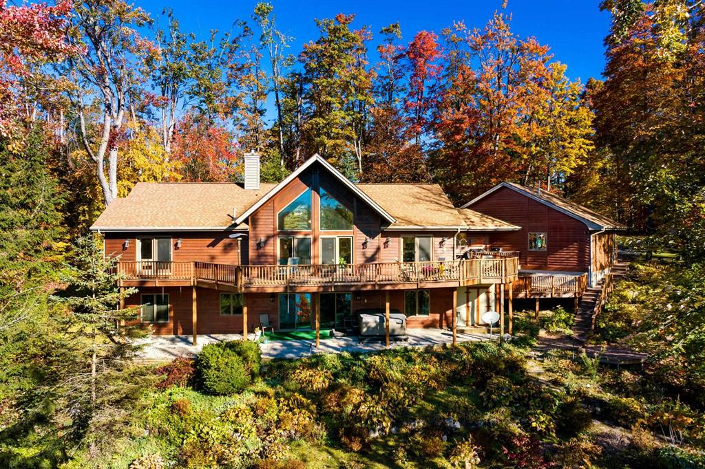 Welcome to 5967 Shore Orchid Drive, a stunning property nestled in the heart of Gaylord with private frontage on Deer Lake! This spacious home boasts a generous lot size of 1.04 acres, providing ample space for outdoor activities and relaxation. With a square footage of 3463, this property offers plenty of room for comfortable living and entertaining. As you step inside, you'll be greeted by an open floor plan that seamlessly flows from room to room. The updated kitchen with quartz counter tops is a chef's dream. The living room is the perfect place to unwind after a long day, with a cozy fireplace and large windows that flood the space with natural light. The master suite is a true retreat, complete with a luxurious en-suite bathroom and walk-in closet. Outside, the expansive backyard is an oasis of tranquility, with lush landscaping and a spacious decking for outdoor dining and relaxation. Plenty of parking for cars and toys in this heated 3 car garage. Additional information can be found online.