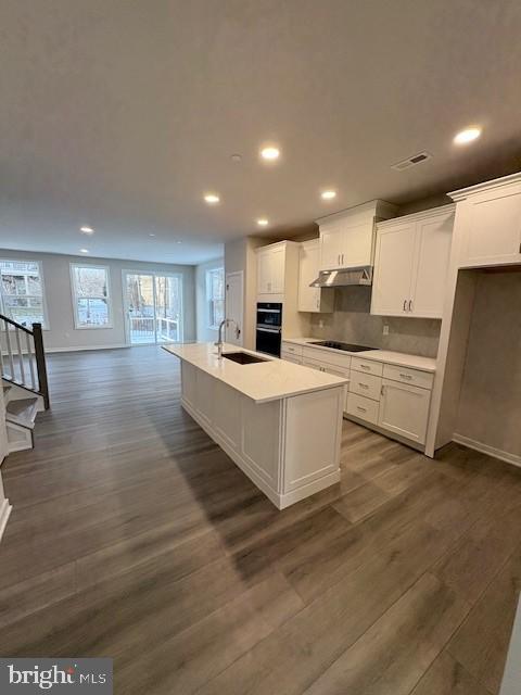 The Brentford Elite is a sundrenched end unit offers everything you are looking for...With an open-concept floor plan and thoughtfully curated finishes, this move-in-ready home is designed for the way you live. The gourmet kitchen truly makes a statement, featuring premium finishes, upgraded cabinetry, and stainless-steel appliances. A warm two-toned cabinet kitchen, serving as the heart of the home, the open-concept great room is highlighted by beautiful luxury vinyl flooring and offers seamless access to the deck—perfect for everyday living and entertaining. A versatile flex room provides the ideal space for a home office, playroom, or hobby area, easily adapting to your lifestyle. Tucked away on the second floor, the expansive primary bedroom offers a private retreat with walk-in closets and a spa-inspired bathroom suite.  Two additional bedrooms share a well-appointed hall bath, while the conveniently located second-floor laundry room adds everyday ease.The finished basement creates additional living space that can be enjoyed in countless ways—whether for relaxation, recreation, or hosting guests.Set within a community featuring open green spaces and scenic walking trails, this home is just minutes from everyday conveniences, making it perfectly suited for your family’s daily routine.Experience the luxury you’ve been waiting for—schedule your private tour today.