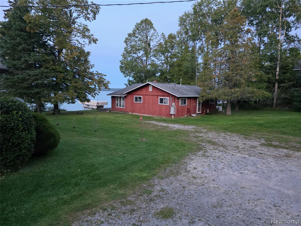 Nestled in the serene landscape of Alcona Township, this 1960's Lakefront Log Cabin is perfectly sequestered near the tip of Hubbard Lakes Hardwood Peninsula & boasts 111ft of lake frontage! Whether from Land or Sea -privacy abounds you everywhere ...given its remote settng near the very end of Hardwood Trail & another 1200-1500' treck down your private two track driveway eventually giving  access to this incredible secluded hideaway & truly amazing throwback in time. This property offers a multitude of options to the Lucky Buyer; whether you rennovate whats there or spend years making memories while enjoying & taking in the endless beauty that surrounds you -or simply start fresh with blank canvas & build that home of a lifetime!! The residence includes a full kitchen & one full bath, two bedrooms, a large family room & year round bonus room for unlimited rest & rejuvenation, Just imagine waking up each morning in your secluded private retreat, fresh & rieady to embrace another day in paradise!. For nearly 60 years (1967), this incredible one-owner cabin was safe harbor for year-round sharing, laughter & fun while creating lifelong memories together! ...Truly, the quitessetial definition of Northern Michigan Recreational Life & Living!! Don't miss this incredible opportunity to experience this absolutely perfect, secluded backdrop setting to enjoy and create endless memories & fun for YOUR family!!
