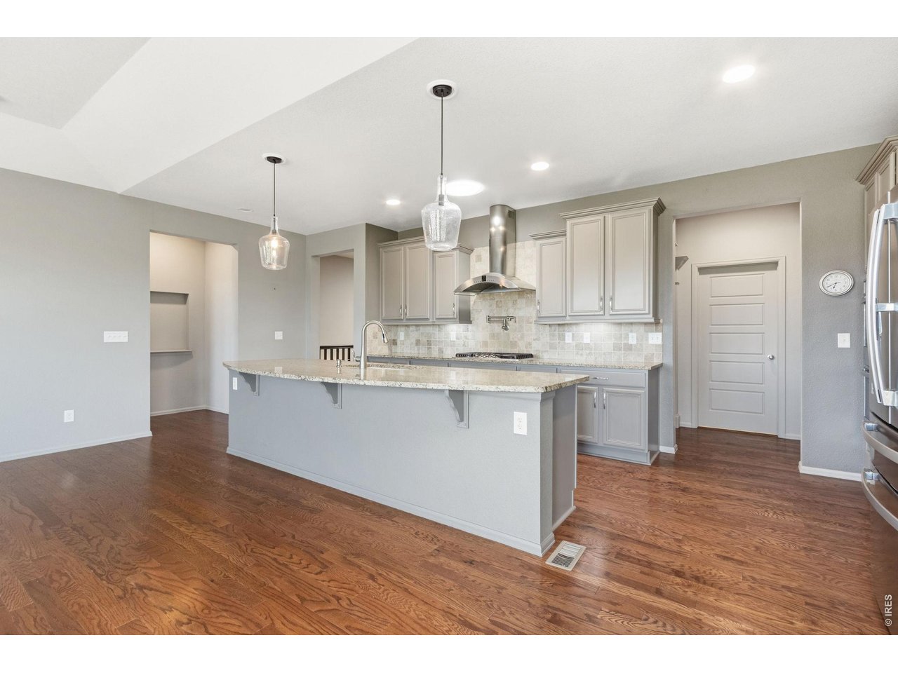 Wow! This is one you won't want to miss! Stunning, move-in-ready 5-bedroom, 3-bath home in the highly sought-after Bucking Horse neighborhood. The chef's kitchen is designed for both everyday living and entertaining, featuring stainless steel appliances, double oven, 6-burner gas cooktop with pot filler, refrigerator, dishwasher, microwave, and a built-in buffet with abundant storage.The spacious primary suite offers a fully remodeled, spa-like en-suite bath and renovated walk-in closet with exceptional storage. The finished basement provides a massive great room, two additional bedrooms, full bath, spacious office, and oversized bonus room-perfect for a home gym, craft room, hobby space, or storage. Step outside to a beautifully landscaped backyard that creates a peaceful oasis for relaxing or entertaining. The property backs to open space and sits along a local walking path, offering easy access to Jessup Farm favorites including The Farmhouse, Pizza Vino, Bindle Coffee, Josh & John's Ice Cream, and more. Bucking Horse HOA amenities include parks, playgrounds, walking trails, and a community pool. Seller upgrades include full interior and exterior paint, new refrigerator, complete primary bath and walk-in closet remodel, new guest bath shower, and professional backyard landscaping with irrigation system. Truly a special home in an exceptional location!