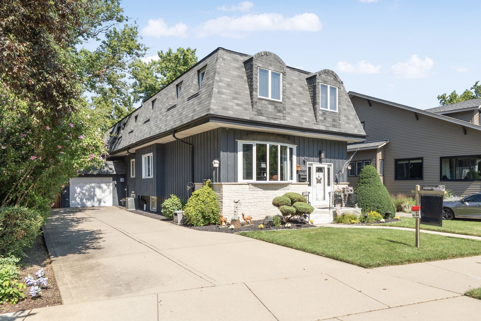 Welcome to 5706 N New Hampshire in historic Old Norwood Park.    This spacious and flexible home offers room to grow with multiple bedrooms and adaptable living spaces-perfect for home offices, a gym, playrooms, or guest rooms.    The kitchen stands out with Amish-made custom cabinetry, providing both craftsmanship and functionality. The family room features a wood-burning fireplace with a gas starter, creating a cozy gathering space. Upstairs, the primary suite offers a gas fireplace, and a spa-like steam shower for the ultimate retreat. Comfort is further enhanced by zoned HVAC for efficient climate control throughout the home.    Parking and storage are unmatched: a large driveway, attached 1-car garage, and an additional 3-car detached garage-a rare find in Chicago. Step outside to a large raised back deck, ideal for entertaining or relaxing outdoors.    Located in desirable Old Norwood Park, you'll enjoy tree-lined streets, historic character, and a true neighborhood feel-all while staying within the city, close to Metra, expressways, parks, and local dining.    If you love Chicago but need more space, this home delivers the best of both worlds.