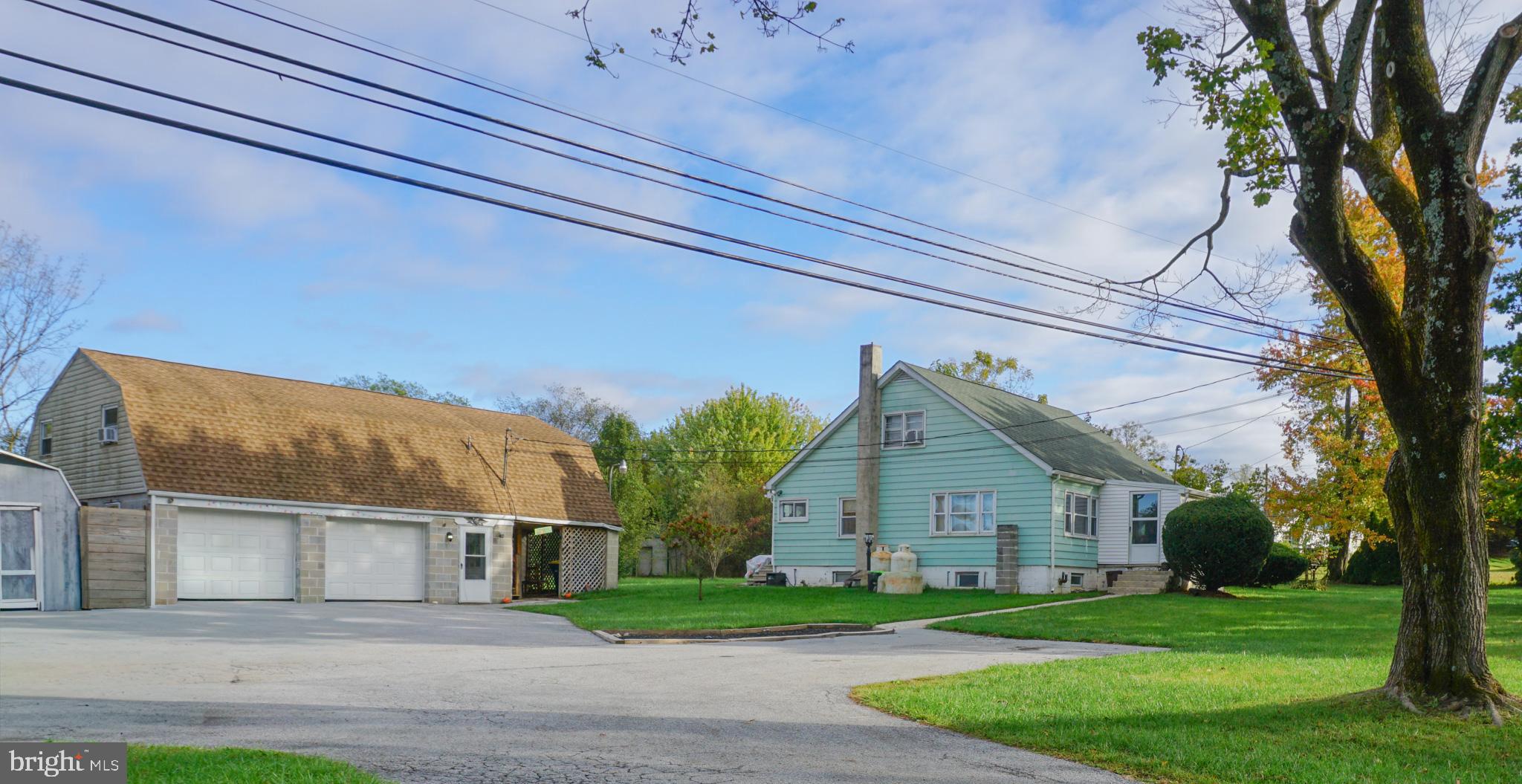 Outstanding investment opportunity in a commercially zoned area, featuring a versatile multi-unit property with strong income potential. The main Cape Cod–style residence offers 3 bedrooms and 1 bath, including a first-floor primary bedroom, a spacious living room, and a large eat-in kitchen. A separate laundry area leads to an ideal workshop or craft room, adding additional utility to the space. Two well-sized bedrooms are located on the second floor.A large detached 2-car garage includes an upper-level apartment, providing an excellent option for rental income, office use, or guest accommodations. The expansive driveway offers ample off-street parking to support both residential and commercial needs.With flexible zoning and multiple use possibilities, this property is well-suited for investors, business owners, or those seeking mixed-use potential. Currently tenant-occupied.ALL MEASUREMENTS ARE ESTIMATED and do not represent actual square footage.