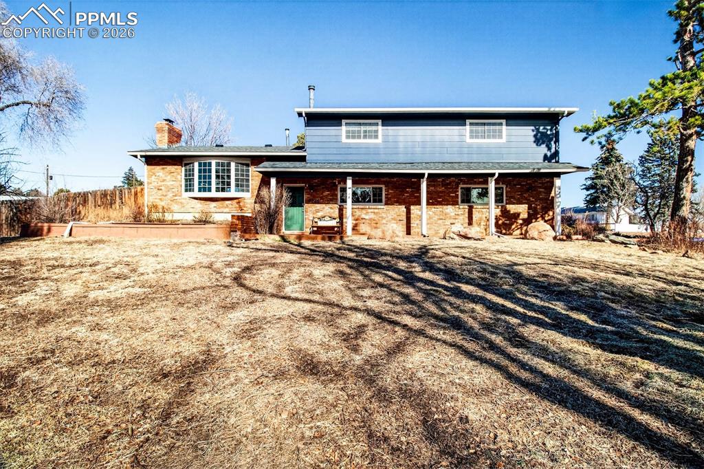 This is a truly rare opportunity to own exactly one acre of land in the middle of Colorado Springs offering privacy, space, & breathtaking mountain views while still enjoying city convenience. Zoned for 2 horses, complete with a barn, this property delivers a lifestyle that’s nearly impossible to find. Inside, the home is warm, inviting, & thoughtfully updated. The main-level family area features newer laminate flooring, custom built-ins, & an entertainment center designed for everyday living & entertaining. Custom barn doors lead to the laundry area, adding character & charm. The home has fresh interior paint, custom window treatments, newer A/C system, newer roof, a stunning updated kitchen with abundant, thoughtfully designed cabinetry, wood flooring throughout the upper levels & bedrooms, & upgraded bathrooms. A standout feature is the lockable main-level bedroom with an attached bath & private exterior entrance, offering exceptional income potential or ideal accommodations for a mother-in-law suite, or guest quarters. Step outside & take in stunning mountain views from the living room, family room, & front porch—perfect for enjoying peaceful mornings, unforgettable sunrises, & quiet Colorado sunsets. The corner lot is framed by mature trees, includes a basketball court, & offers plenty of space to relax, play, or expand your outdoor vision. Additional highlights include a stand-up crawl space recently upgraded with crushed concrete floors, providing accessible & ample storage with easy HVAC access, along with an oversized garage featuring a dedicated workshop, perfect for hobbies, storage or projects. This is more than a home, it’s a rare lifestyle property offering space, privacy, income potential, & sweeping scenery in a location where acreage is almost unheard of. Homes like this simply don’t exist anymore—where acreage, views, flexibility, & modern updates come together in the heart of the city while still offering the peace & quiet of true Colorado living.