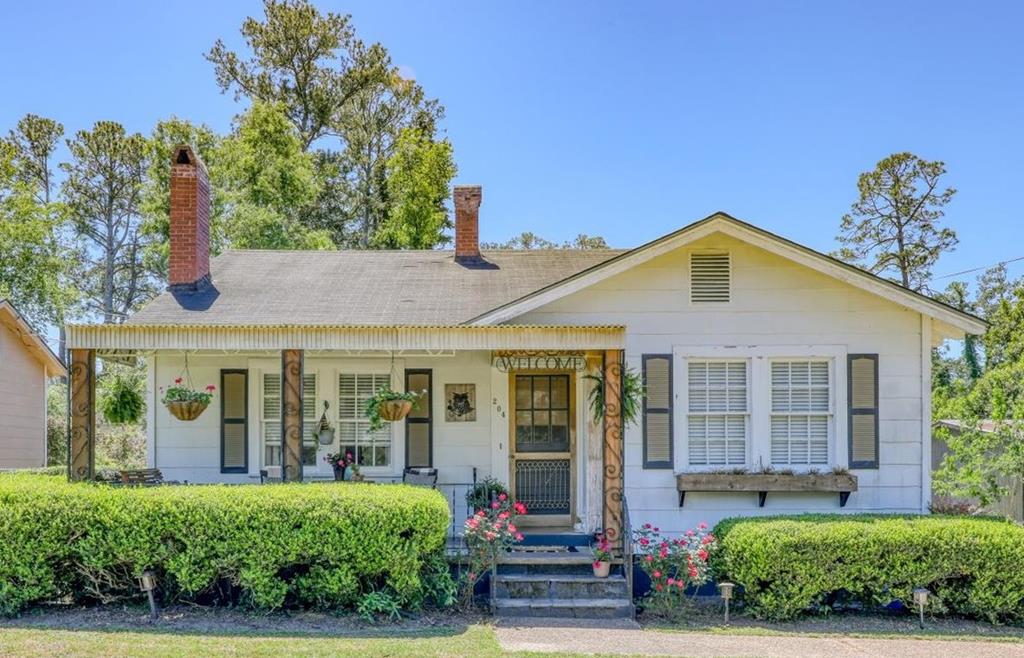 204 Oak Street is a true expression of timeless charm in the heart of Quitman. This beautifully restored 3-bedroom, 2-bath home blends the character of historic architecture with the comfort and ease today's buyers are looking for, creating a setting that feels both warm and refined.  From the moment you arrive, there's an undeniable sense of place—where quiet streets, friendly neighbors, and the rhythm of small-town living come together. Inside, the home has been thoughtfully maintained and restored, preserving its original charm while ensuring it's completely move-in ready. Spacious living areas, abundant natural light, and well-appointed bedrooms offer both functionality and comfort for everyday living.  Step outside to a private, fenced backyard—perfect for pets, entertaining, or simply enjoying a quiet South Georgia evening under the open sky. A detached garage adds convenience and extra storage, while the separate “man cave” space offers incredible flexibility—ideal for a home office, game room, or easily converted into a charming guest house for visitors or extended family.  Whether you're drawn to the craftsmanship of a bygone era or simply looking for a home that feels welcoming from the start, this property delivers. It's the kind of place where mornings begin a little slower, evenings stretch a little longer, and life feels just a bit more connected.  Located just moments from Quitman's quaint downtown, local shops, and schools, this home offers not only a place to live—but a lifestyle rooted in history, community, and Southern charm.