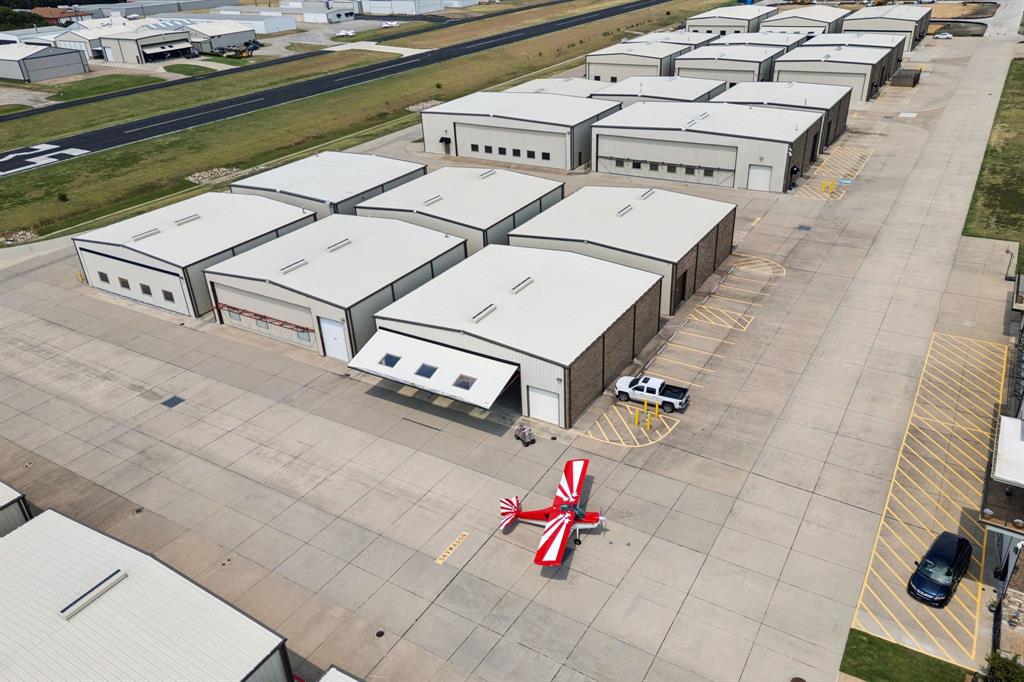NEW-CONSTRUCTION AIRCRAFT HANGAR: NEW DEVELOPMENT AT AERO COUNTRY EAST AIRPORT, T31, MCKINNEY, TX. Hangar Footprint: 60W X 60L x 25H HANGAR, with single panel hangar door: 54 x 18, with 4 windows and hydraulic PowerLift hangar door opener, with 2 remotes. Hangar includes half-bath, LED hangar lights, outdoor water bib, 220 electric panel and more. Estimated completion of hangar construction: December 2025. CUSTOMIZE YOUR HANGAR:  We can add a mezzanine, pilot's crew quarters, home office or residential living.  T31 AIRPORT INFORMATION:  3000' Paved & Lighted Runway 17-35, PLUS a 1500' airstrip. Aircraft wight limit: up to 6500 lbs. NO FLIGHT SCHOOLS. HOA-CITY REGS: Not for full-time residential use. (Part-time residential use allowed, welcomed & encouraged.) HANGARS ARE NOT FOR COMMERCIAL USE OR RETAIL BUSINESS USE; (Strictly enforced). AMENITITES: Gated airport & community pool & amenity center for owners & guests.  OWN THE LAND. THIS IS NOT A GROUND LEASE. Come join an amazing group of aviators and make T31 your home airport. Conveniently located west of Dallas North Tollway & south of HWY 380. UNDERGROUND UTILITIES: City water, city sewer, high speed fiber optics and natural gas. BRING YOUR AIRCRAFT, MOTORCYCLES, CAR COLLECTION, RV's, BOATS AND TOYS!