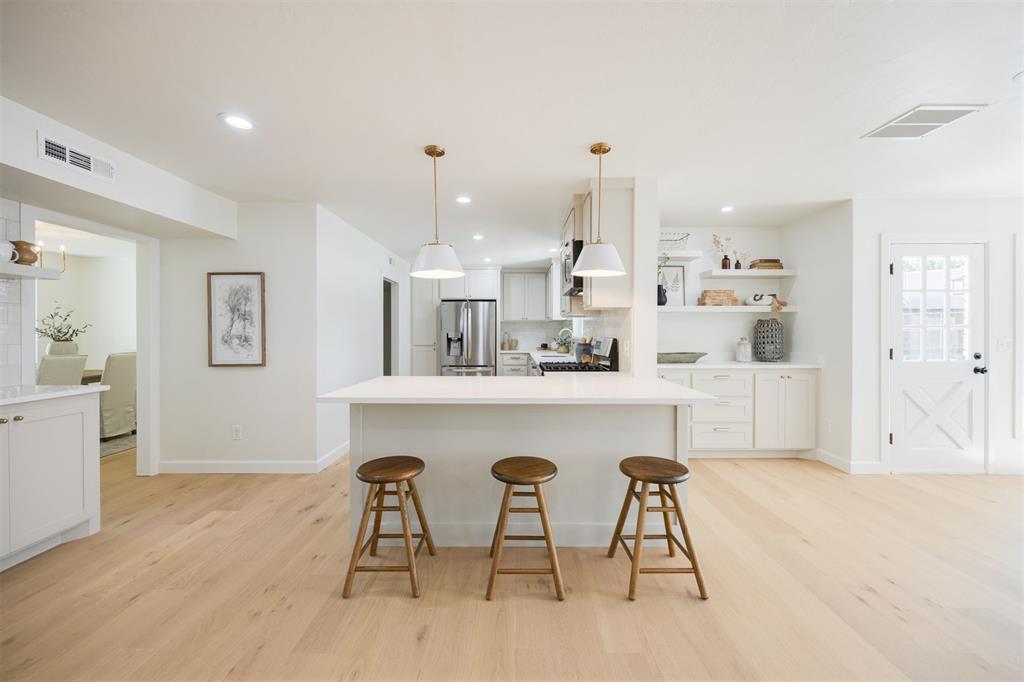 *OPEN HOUSE SUNDAY SEPT 14 FROM 2:00 to 4:00 PM*  A remarkable renovation on Blue Sage Road in beloved Quail Creek! This home is whisked from a dream - featuring 5 bedrooms, 3.5 bathrooms, 2 living areas & a dedicated study- you couldn’t imagine a more functional floor plan. Simplistic elegance is found at every turn. A grand entrance showcases soaring ceilings, with a study to your right. Stunning light wood flooring covers the first floor of the home and lead you to the living areas & kitchen. A living space with a cozy fireplace at its center opens to an impressively renovated kitchen- featuring quartz counters, new cabinetry, stainless appliances and two separate nooks/hutches of additional cabinetry. A formal dining is found just adjacent to the kitchen, perfectly situated for hosting holiday dinners or game nights. The main living room is truly breathtaking; an alcove of light- offering views of a stately magnolia tree & lush backyard- and the amount of space is even better. This room is the heart of the home, where entertaining is effortless. The second level of the home is equally as alluring, with romantic finishes & lighting woven through. Three very spacious bedrooms enjoy access to a dreamy full bathroom. The expansive master suite showcases an enormous, versatile walk-in closet and fully renovated bathroom - with floating tub, double vanity & shower. An additional en-suite features two closets and a full bathroom. An amazing floor plan with so many uses, no matter your stage of life! Enjoy privacy and security compliments of the gated driveway - with additional parking out back, a lovely patio and ample green space. An extensive renovation comprising of upgraded mechanicals & every surface of the home refreshed and revived with timeless style & finishes. Impactful upgrades include new roof [2024], electrical wiring + panel [2024], all interior plumbing [2025], HVAC systems [2022], windows [2025], trim & baseboards throughout [2025].