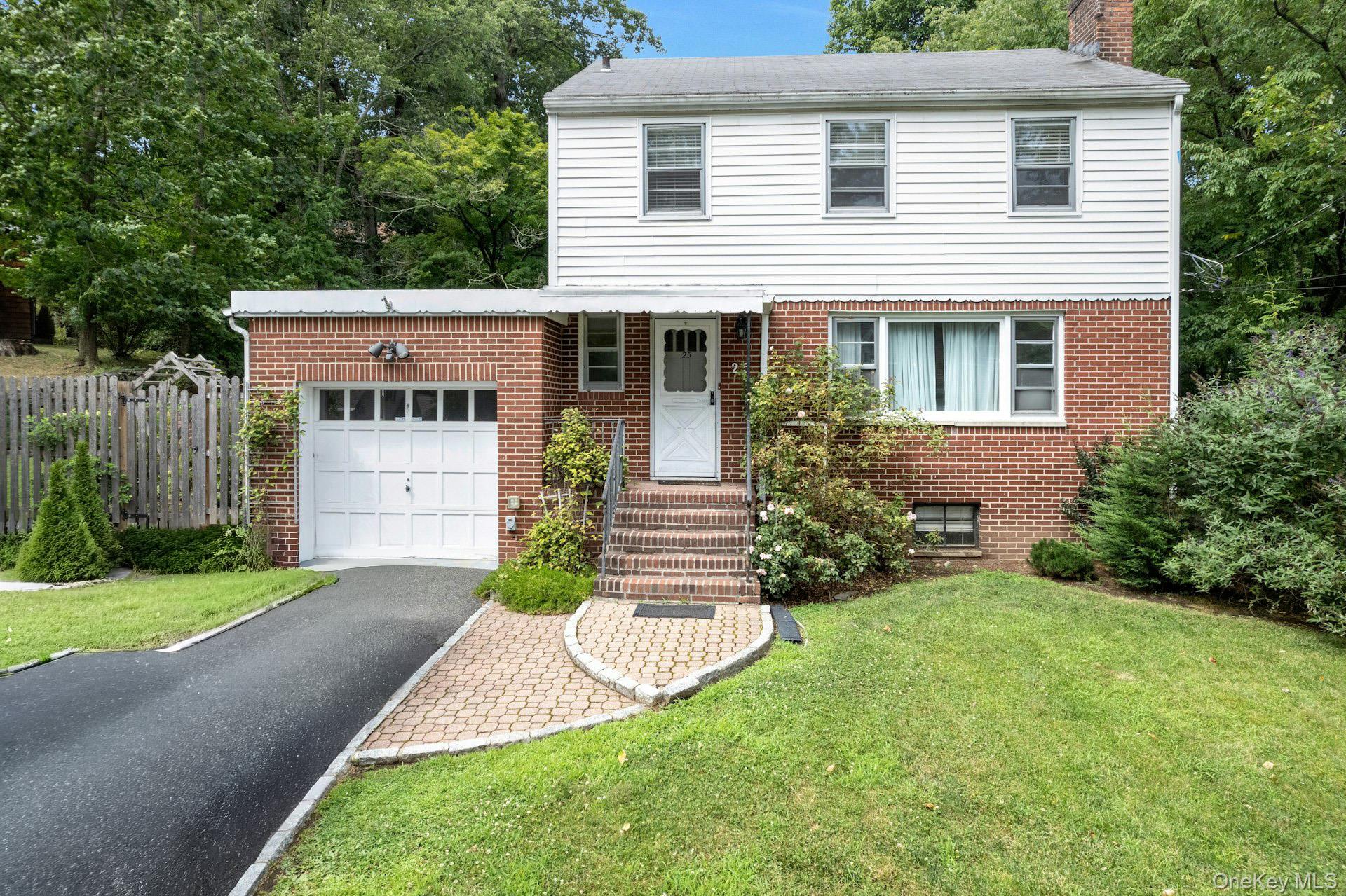 A Colonial home in desirable Hastings on Hudson, nestled on a quiet street close to the village. With hardwood floors, three bedrooms, and a 1.5 bath home, this residence features a living room with a wood-burning fireplace, a dining room that flows into an L-shaped kitchen, and a den with a door leading out to a large, level backyard. Basement with laundry room and utilities.  There is bonus space in the basement that can be used as a rec room, office, or family room. Plenty of storage in the attic and basement. Hastings-on-Hudson is a great place to call home. Come and enjoy all the best Westchester has to offer. Quick commute into Grand Central Station, biking, rowing on the Hudson, or spend the day relaxing in your own park-like backyard.