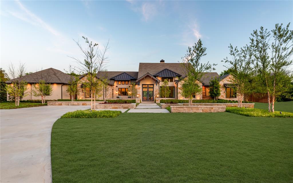 Tucked behind a secluded cul-de-sac in Stonebridge Ranch, this custom single-story estate by renowned builder GG Caine sits on a rare, fully treed acre lot where nature surrounds every corner and privacy is absolute. Inspired by the Texas Hill Country and finished to resort-level standards, this home has never been publicly offered for sale. There is nothing else like it in McKinney.A private front courtyard with a tranquil fountain sets the tone upon arrival. Inside, soaring ceilings and walls of glass blur the line between interior living and the lush, mature landscape beyond, with every room intentionally positioned to capture the natural setting that surrounds it. The chef's kitchen is both a statement and a gathering place, featuring custom cabinetry, elevated finishes, a butler's pantry, and a designer-tiled built-in bar that is equal parts function and showpiece. A dedicated movie room, private office, and lodge-inspired flex living space complete an interior designed for deep comfort and effortless entertaining.The primary suite is a world apart, a private wing with a spa-caliber bath, soaking tub, separate vanities, walk-in shower, and a custom closet. A private outdoor shower and dedicated yoga and relaxation garden extend the retreat beyond the walls of the home. Every additional bedroom is a fully ensuite suite, with a separate pool bath serving the outdoor living areas.Outside, an infinity-edge pool anchors an experience that feels more private resort than residence. Professional landscaping, mature trees, and curated outdoor lighting create an atmosphere of serenity both day and night. A peaceful yoga garden, turfed dog run, and separate pet fencing ensure the grounds are as livable as they are breathtaking. Three-car garage and extended guest parking complete the picture. This is not just a home. It is an experience. A private retreat. A place that feels like a vacation every single day.