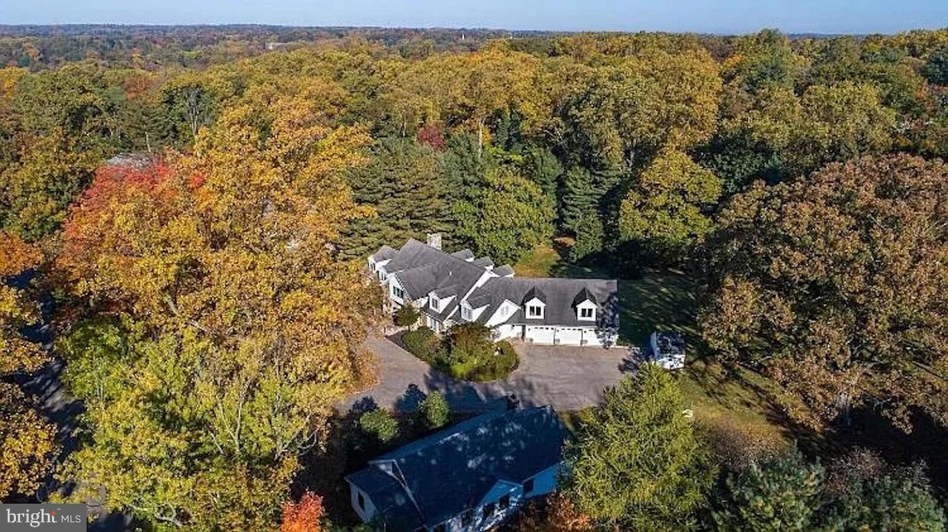 A private 2.43-acre estate featuring a 6,898 sq.ft. custom main home and an 1,800 sq.ft. detached guest house/office — offering rare versatility, privacy, and scale.  The main home, 239 Old Gulph Rd, features 5 bedrooms, 5 full bathrooms and 2 half bathrooms, with expansive living areas, multiple suites, and entertainment spaces ideal for everyday comfort and large gatherings. The first-floor master bedroom includes two bathrooms and a walk-in closet. Upstairs, the junior master bedroom includes a private bath, while three additional bedrooms share a hallway bathroom. Each bedroom includes its own closet for abundant storage. The walk-out basement provides a full 1-bedroom, 1-bath private apartment, complete with a separate entrance, full kitchen, private bathroom, and dedicated laundry — perfect for extended family, long-term guests, or supplemental rental income.  The detached guest house, 301 Old Gulph Rd with 3-bedroom, 2-bath  includes a full kitchen, private parking and its own drive way, offering additional space and flexibility for multigenerational living, a home office, or additional rental opportunity. Outdoors, the property offers a large backyard, an oversized 3-car garage, and beautiful open green spaces — an ideal setting for children to run, play, and enjoy year-round outdoor activities. A dedicated vegetable garden adds extra charm and functionality. The estate offers strong potential for customization, allowing the next owner to  reconfigure or enhance it into a dream house. Excellent investment value as well, with past rental income of $8,400/month for the main house and $3,700/month for the guest house, totaling over $12,000/month. Total living space is approx. 8,700 sq.ft. across two structures. An ideal opportunity for multi-generational families, home-office setups, dual-residence living or investment use.