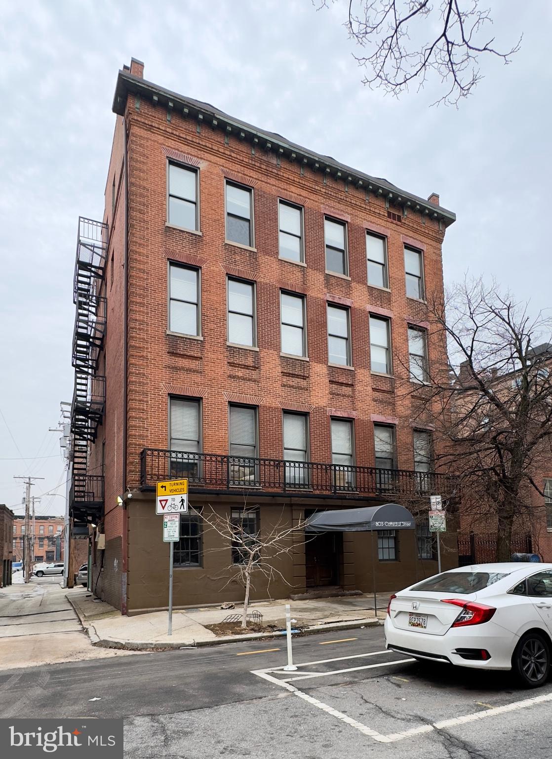 Experience elevated city living at 803-805 Cathedral St - Unit 09, Baltimore, MD 21202, a distinctive unit nestled in the heart of downtown. This unit stands out with its unique sloped ceilings that add architectural character and dimension, creating a space that feels both dynamic and inviting. With generous square footage, an open layout, and modern finishes, Unit 09 delivers a rare blend of charm and functionality in a prime urban setting.Step inside and immediately notice the rich wood flooring that flows throughout the main living areas. The open layout connects the living, dining, and kitchen spaces seamlessly, making it perfect for entertaining or unwinding at home. The sloped ceilings elevate the design, giving the area a loft inspired feel while maintaining warmth and comfort. Neutral tones complete the space, while natural light enhances the airy atmosphere.The kitchen is designed to impress and perform. Granite countertops provide ample preparation space, and the stainless steel appliance package includes a stove and oven, dishwasher, microwave, and refrigerator. The open concept ensures you remain connected to guests or family while cooking, making everyday living and hosting effortless.All three bedrooms are well proportioned and thoughtfully designed. Each room features wall to wall carpeting, neutral color palettes, and dedicated closets. The sloped ceiling lines continue in select areas, adding visual interest and a cozy, private ambiance. Large windows invite in natural light, creating bright and comfortable retreats for rest and relaxation.Both bathrooms are finished with tiled flooring and modern fixtures. Bathroom one includes a bathtub, vanity mirror, lavatory, cabinet storage, and a skylight that fills the space with natural light. Bathroom two features a walk in shower, vanity mirror, lavatory, cabinet storage, and a skylight, offering a sleek and refreshing setting for your daily routine.For added convenience, the unit includes an in home washer and dryer, allowing you to handle laundry with ease and privacy.Street parking is available, and the unbeatable location places you in the center of Baltimore’s cultural and professional hub. Dining, entertainment, universities, and major employers are all just moments away.Pets are welcome with a pet addendum, a $500 non refundable pet fee, and $25 monthly pet rent per pet.Monthly Water Fee: $25.00 per occupantLive steps away from some of Baltimore’s most iconic destinations:• Washington Monument• The Walters Art Museum• Peabody Institute• University of Maryland Medical Center• Inner HarborOpportunities like this with architectural character in such a prime downtown setting do not last long. Schedule your private tour and secure your place in one of Baltimore’s most vibrant neighborhoods.RENTAL LICENSE No.: L-516171Agency disclosed upon initial contact. Agent conducts showings; BMG manages follow-up, paperwork, move-in post-approval. Vouchers work with BMG directly.
