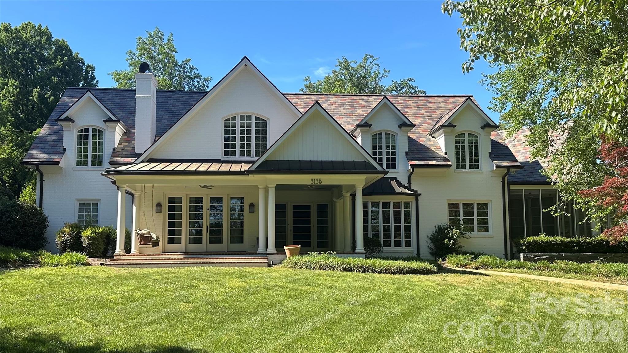 Welcome to 3135 Loma Lane—an extraordinary estate opportunity tucked away on a private cul-de-sac in one of Charlotte’s most coveted and established enclaves, just moments from Charlotte Country Club and minutes to Uptown.Set on an expansive 0.76-acre lot, this stately residence offers just under 6,900 square feet, 6 bedrooms, and 6.5 bathrooms in the main home, and an additional 690 square foot detached living quarter—providing a rare combination of scale, privacy, and location that is increasingly difficult to find in Charlotte’s in-town market.Originally constructed with enduring quality and thoughtfully expanded with a second-story addition, the home blends classic architecture with generous living spaces designed for both everyday comfort and large-scale entertaining. From the moment you enter, you’re met with an abundance of natural light, multiple gathering areas, and a flowing layout that invites connection.Outdoors, the property transforms into a true retreat—featuring a resort-style pool, mature landscaping, and a detached garage apartment with kitchenette and full bath, ideal for guests, extended stays, or private workspace.Whether enjoyed in its current form or reimagined to reflect a buyer’s personal vision, this home presents a rare opportunity to own a legacy property in one of Charlotte’s most sought-after locations.