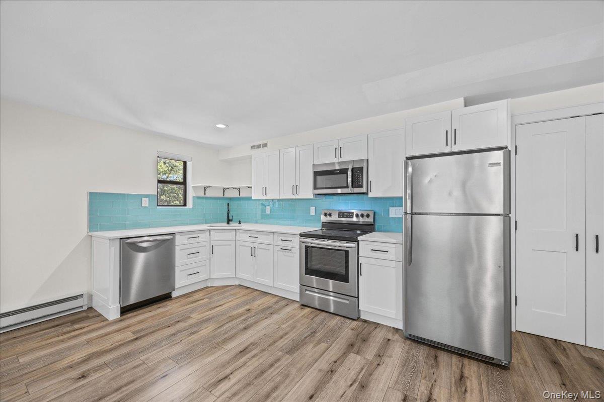 Welcome to 55 Fieldstone Drive, Unit #55, in the desirable Hartsdale Manor community of Hartsdale. This beautifully maintained, pet-friendly 1-bedroom, 1-bathroom home offers a bright and inviting open floor plan designed for comfortable everyday living. The updated open kitchen features elegant quartz countertops, stainless steel appliances, a dishwasher, and seamless flow into the living and dining areas, making it ideal for both relaxing and entertaining. Recessed lighting and durable vinyl flooring add a modern touch throughout, while the welcoming entrance foyer provides a warm first impression. Additional conveniences include common-area laundry facilities and one unassigned parking space.Residents of Hartsdale Manor enjoy a variety of community amenities, including a beautifully maintained in-ground pool and nearby park areas perfect for recreation and outdoor enjoyment. Conveniently located in the heart of Hartsdale, this home offers easy access to shopping, restaurants, cafes, and everyday conveniences, as well as the Hartsdale Metro-North station for a quick commute to Manhattan. Nearby parks, golf courses, and the vibrant downtown areas of Hartsdale, White Plains, and Scarsdale provide endless opportunities for dining, entertainment, and leisure, making this an exceptional place to call home.