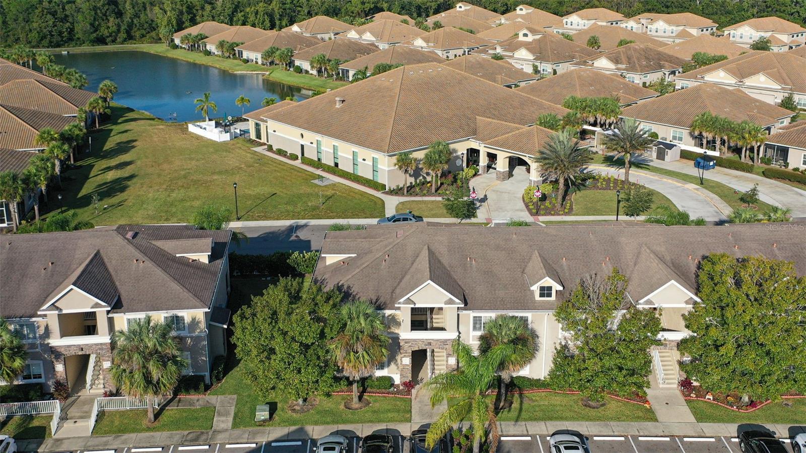 Welcome Home to Anand Vihar – Wesley Chapel’s Premier 55+ Gated Community! Experience carefree, resort-style living in this turn-key, furnished optional, move-in ready condo located in Anand Vihar, Wesley Chapel’s exclusive 55+ community. This meticulously maintained 3-bedroom, 2-bath-split-floor plan offers everything you need to move right in and start enjoying the lifestyle you deserve. Step inside to discover beautiful tile flooring throughout and an inviting open-concept kitchen with stunning quartz countertop, stainless appliances, breakfast bar, beautiful wood cabinets, and generous counter space — perfect for cooking or entertaining. The spacious owner’s suite is a serene retreat featuring dual walk-in closets, and a luxurious bath with a large walk-in shower. The 2 guest bedrooms share a full bath, with tub & shower that offers luxury & privacy for visitors. Enjoy and relax on your private screened lanai, overlooking a peaceful landscape view, or take a short stroll-steps away to the Anand Vihar clubhouse, where you’ll find resort-style amenities including a heated pool, hot tub, fitness center, steam room,yoga and meditation room, movie room, and community lounge for social gatherings. Enjoy freshly prepared meals for lunch and dinner for a small fee at the on-site restaurant in the clubhouse, featuring authentic cuisine from various regions of India — a true taste of home and community. Walking areas throughout the beautifully maintained grounds and outside the community, offering a tranquil setting for daily walks. HOA Fee includes: Clubhouse, Cable, Internet, Insurance, Exterior maintenance, trash pickup, landscaping, Irrigation-owners just pay for water & electric. Close to all, Golf Courses, Shopping, Wiregrass mall, Premium outlet mall, Entertainment, The Groves, Restaurants, Flat woods preserve,hospitals, minutes from Tampa Airport, downtown, all major highways I-275, I-75, I-4. Don’t miss your opportunity to own this beautiful home—schedule your private showing today and experience luxury Florida living!