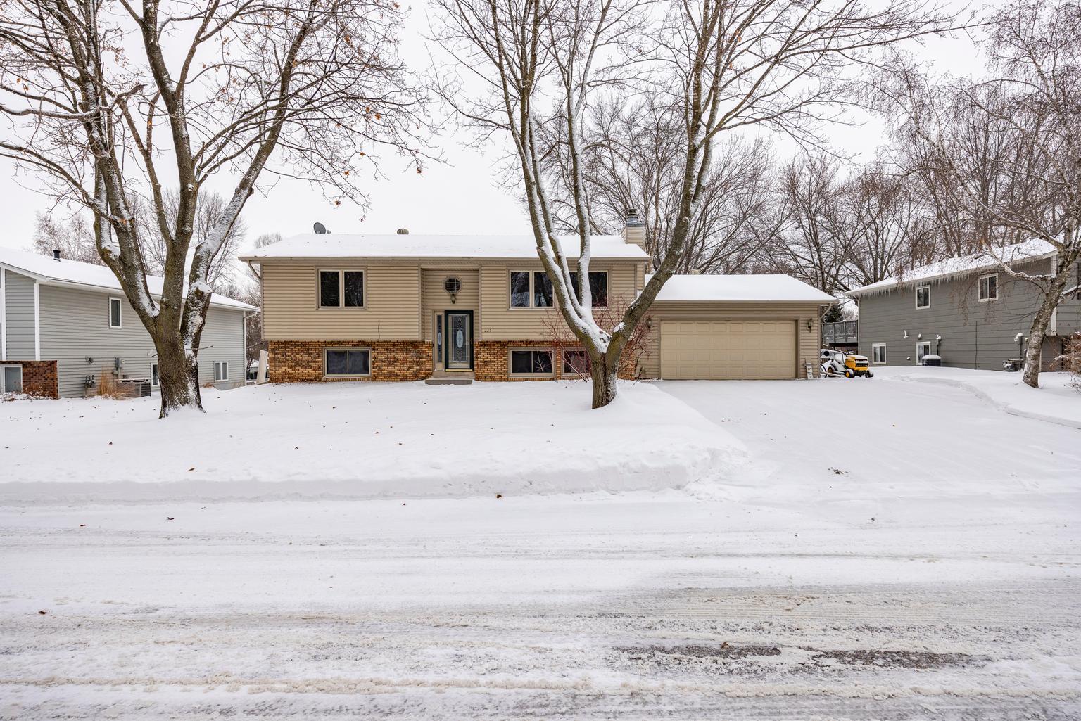 Discover the ease and comfort of everyday living in this lovely, move-in ready four-bedroom home in Chaska. You’re welcomed by a bright, inviting foyer that opens to a light-filled living room, where large windows create a warm, welcoming atmosphere. The dining room and kitchen flow seamlessly together, offering an open, functional layout that fits today’s modern lifestyle. Cooking is a pleasure in the spacious kitchen with ample cabinetry, generous counter space, and room to gather including an inviting breakfast bar. The expansive four-season sunroom is a true highlight—flooded with natural light and perfect for relaxing year-round or entertaining guests. From here, step out onto the deck overlooking your own private outdoor oasis, featuring a large backyard, a deck, a patio and an outdoor seating area, all ideal settings for summer dinners or enjoying the outdoors. The main level offers two bedrooms along with a full bathroom featuring a separate tub and shower. The lower level has another bathroom and two bedrooms and a family room, providing flexibility for guests, home offices, or growing households, and expands your living space with room to unwind, play, or create while still offering plenty of storage throughout.  With a generous backyard, versatile living spaces, and a location close to parks, shopping, and dining, this Chaska home truly has it all.