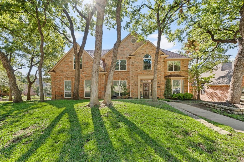 Gorgeous and move-in ready, this beautifully maintained family home on an expansive corner lot blends classic charm with modern functionality in the highly desirable GCISD school district. The gourmet kitchen features quartz countertops, a large island, chefs 5 burner gas cooktop, stainless steel appliances and a farmhouse style sink. Downstairs offers luxury vinyl flooring throughout, an office, two spacious living rooms, and two dining rooms. Upstairs offers a huge primary bedroom with an ensuite bonus fifth bedroom with French doors which  also could be utilized as an ensuite office, nursery or play area. The ensuite designer bathroom with a double shower, double sinks and freestanding tub, offers a spa-like setting. The backyard is a true oasis designed for year round enjoyment with a fire pit nestled under the trees, perfect for entertaining or relaxing! A barn and shed offer generous outside storage. Don’t miss this rare opportunity to own a home that combines tranquil living with unmatched accessibility just minutes from DFW airport, shopping restaurants and entertainment. Easy and close access to highways 121, 114 and 360.