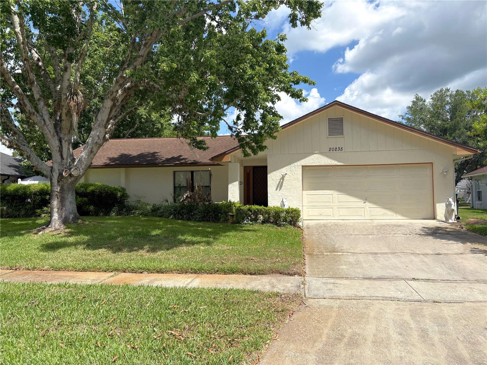 Located in desirable Wedgefield Golf Community! NO HOA! Move in ready 3 bedroom 2 bath home with 2 car garage! Formal Living, Dining, and family room. Kitchen with all appliances, breakfast bar, and eat-in area. Large owner's suite with walk-in closet. Big screened-in porch in back. Huge yard and no rear neighbors. Roof 2015. Home is ready for updates and personal touches to truly shine. Bring your golf cart and enjoy Wedgefield Golf Course. Must see!