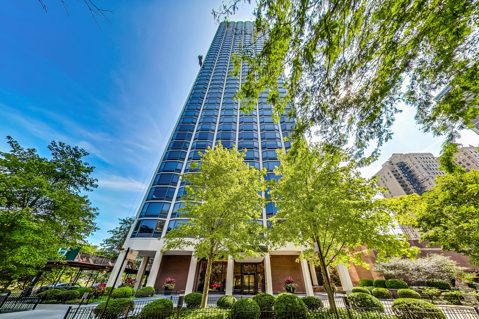 Stunning corner unit on Chicago's historic Astor Street overlooking the Lake with East West and South city views.  Split two bedroom floorplan features hardwood floors throughout.  Massive south facing living room with separate formal dining room leads to white neutral kitchen with granite countertops, bosch dishwasher and double ovens,  and stainless extra Wide Sub Zero refrigerator.  The large island/breakfast bar make entertaining effortless. The south facing primary bedroom en Suite with professionally organized walk-in closet.  Second large bedroom with abundant closet space offers privacy with adjacent guest marble/granite second bathroom.  Full amenity building offers an indoor pool,  tennis court, workout facility, large sundeck with common gas grills, lounging area and table seating.  Steps from Lakeshore Drive,  underground access to the North Avenue and Oak Street beach, Lincoln Park, farmers market,  etc.   Bike and run along Chicago's lakefront witin minutes from your door.