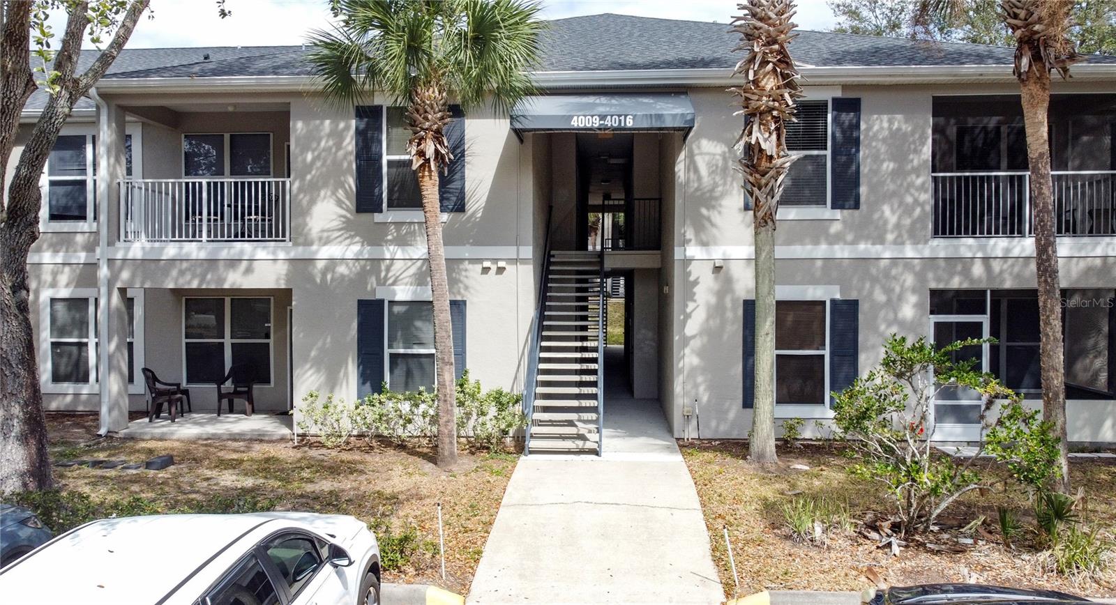 Fully furnished, second-floor condo located within the award-winning, gated Southern Dunes Golf & Country Club, offering turnkey convenience and effortless Florida living. Pride of ownership is immediately evident with fresh interior paint, elegant furnishings and an airy floor plan. This two-bedroom, two-bath residence features a neutral color palette and a seamless flow between the living, dining, and kitchen areas, ideal for both everyday living and entertaining. The kitchen offers ample cabinetry, a breakfast bar for casual dining, and a dedicated dining space perfect for hosting friends and family. The generously sized primary suite includes a walk-in closet, a separate linen closet, and a private en-suite bath, while the second bedroom is well-proportioned with its own walk-in closet and is conveniently located next to the second full bathroom. Additional highlights include an indoor laundry room and multiple storage and linen closets, providing excellent functionality for full-time or seasonal use. Step outside to your private porch with space for seating, creating a relaxing setting to enjoy year-round. Ideally positioned just steps from the community pool, fitness center, and clubhouse, this residence is located within a championship golf community offering 24-hour security, tennis courts, multiple community pools, a fitness center, clubhouse, and driving range. Conveniently located within easy reach of Orlando and Tampa attractions, airports, shopping, Legoland, and both the Gulf and Atlantic beaches. This property offers great value for a new owner. Whether used as a primary residence, vacation home, or long- or short-term rental, this condo presents an excellent opportunity for low-maintenance living in a sought-after golf community.
