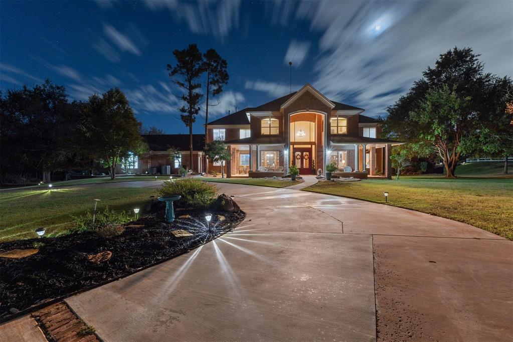 Peaceful Deer Creek retreat on 10+ wooded acres (2 adjacent 5.02 acre lots) designed for comfort, privacy, & unforgettable entertaining. This custom home blends timeless craftsmanship w/resort-style living—featuring 20-ft expansive ceilings, preserved red oak millwork, & a 400-gallon marine-grade live coral aquarium that makes a stunning addition to the living room. The sun-filled atrium was previously used as an indoor garden area has been transformed into an open & airy sunroom connected to the living area w/new light-filtering shades overlooking the 40,000-gallon heated pool w/3 waterfalls. The kitchen has imported Italian granite, dual sinks, a Sub-Zero fridge & freezer (recently rebuilt, refacing option for stainless), wet bar, & walk-in pantry. The spacious primary suite includes an inset jetted tub, private loft w/balcony, & an in-floor safe. On the opposite side from the primary is a main-level full bath near the garage that is ideal for swimmers, & a large laundry room that offers exterior access, a built-in desk, & abundant storage. Upstairs, a second primary suite, 2 bedrooms, & bonus area w/4 storage closets offer flexible living. Attached epoxy-floored garage located next to basement access, includes an air-conditioned storage room & an oversized middle bay. The separate greenhouse w/its own garage provides water, heat, & power. Enjoy 2 ponds (floating dock & tiki hut), a koi pond w/4 mature koi & 4 goldfish, sustainable landscaping, & professionally installed in-ground adjustable basketball goal. All HVAC systems serviced twice yearly; most pumps, automation, & pool systems replaced in 2024-25. Automated 15-zone irrigation (& 2-zone drive system) maintains the grounds & fishing pond. Water well w/the future option to connect to Deer Creek water. No HOA. Home is enclosed with vinyl fencing on 3 sides w/entry gate on the north side. Currently a successful Airbnb—financials avail upon request. Contact listing agent for a full list of features/upgrades.