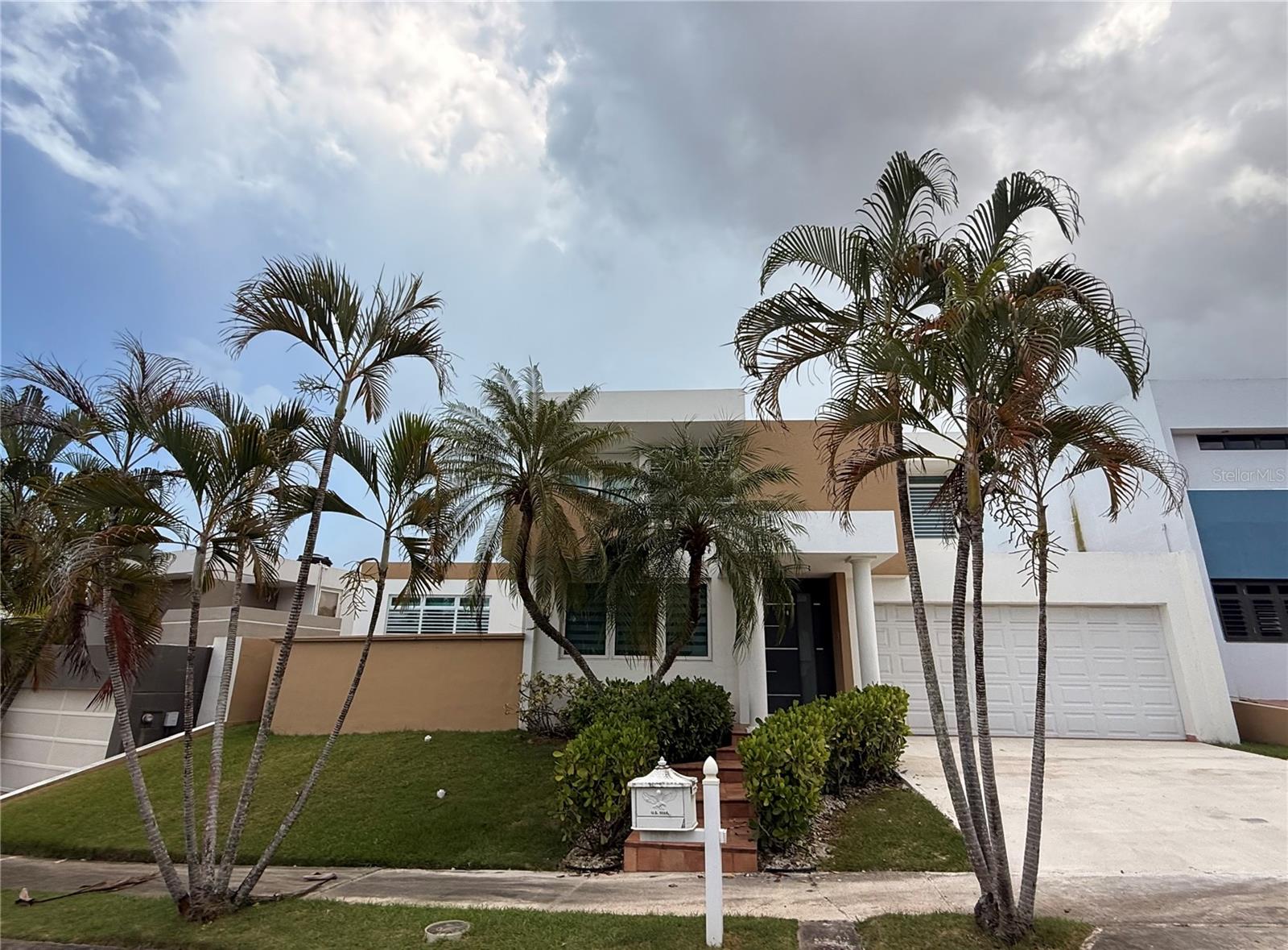 Discover this beautiful residence in one of Guaynabo’s most desirable gated communities, offering convenient access to PR-199. Ideally located just minutes from top-rated schools, shopping centers, restaurants, and hospitals, this property combines comfort, convenience, and an exceptional location.Property Highlights4 Bedrooms, including a private in-law suite on the first floor with a separate street entrance, full bathroom, and kitchenette—ideal for extended family or guests.Modern, fully equipped kitchen.Open-concept living spaces featuring an entrance foyer, living room, dining room, and family room.Covered terrace and spacious 560 m² backyard, perfect for outdoor entertaining and family gatherings.2,650 square feet of living area.Gas-powered generator and water cistern.Enclosed garageSix split-unit air conditioners and ceiling fans.Security doors and windows.Windows curtains included.Monthly maintenance fee: $105CRIM property taxes: $1,102 semiannuallyEnjoy a home designed for comfortable living, with versatile spaces, added privacy, and convenient access to everything in Guaynabo.Schedule your private showing today and discover your next home!