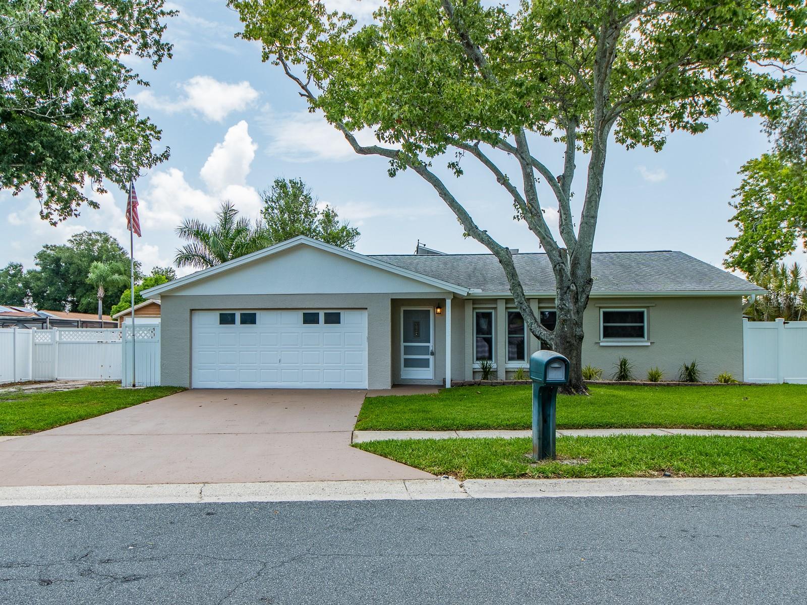 Beautifully remodeled and move-in ready! This stunning 3-bedroom, 2-bath home with a 2-car garage sits on a desirable corner lot in the heart of Largo and offers the perfect blend of style, comfort, and efficiency. The recently remodeled kitchen and bathrooms, along with all-new flooring, create a fresh, modern feel throughout. The spacious, air-conditioned Florida room provides valuable additional living space, perfect for relaxing, entertaining, or working from home.Thoughtfully updated from top to bottom, this home features fully paid-off solar panels, a new electrical panel and new electrical outlets (2026), newer double-pane windows, and storm shutters for the entire home, providing energy efficiency, modern convenience, and peace of mind. The fully fenced backyard with durable vinyl fencing includes two oversized storage sheds, one nearly the size of a one-car garage—ideal for a workshop, hobbies, extra storage, or all your beach and lawn equipment.Ideally located in the heart of Largo, you'll enjoy quick access to Seminole City Center's shopping, restaurants, and entertainment, while being just five minutes from the award-winning Gulf beaches of Pinellas County. With quality upgrades, exceptional outdoor storage, and an unbeatable location, this beautifully updated home is truly move-in ready and ready to impress! Some photographs have been virtually staged.