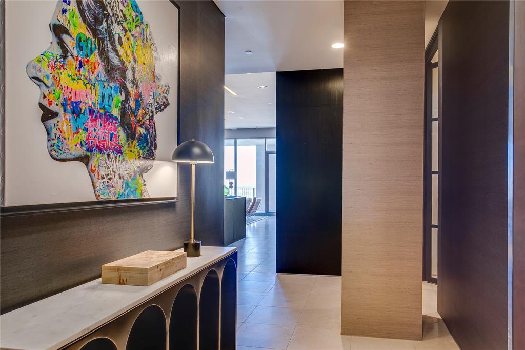One of a kind custom floor plan at the iconic Lionel Morrison designed One Arts. This 19th floor unit has been recently updated to include custom Philip Jeffreys wallpapers and carpet in the main bedroom.  Walk in closet with electric shoe carousel plus a  spa bathroom with a Toto electric toilet. Second bedroom with custom metal and glass sound proof door. Walls of dark walnut exotic wood and Zebra wood custom Bulthaup kitchen with  an island in marble and stainless steel and matching dining table to convey with sale. Custom lighting and working fireplace and a separate office area plus a large outside patio with storage  make this a sophisticated elegant  home.. A must see.