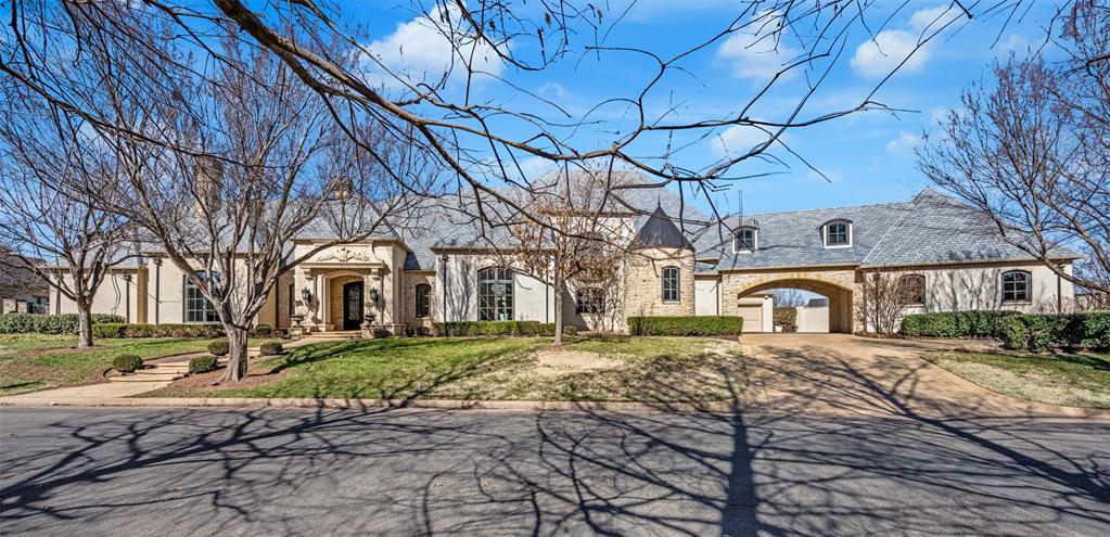 Stunning, fully reimagined luxury residence in the prestigious Gaillardia community. This exceptional home has just completed an extensive $1.5M+ remodel spanning over 1.5 years, transforming the property into a true showpiece with thoughtful design, premium finishes, and an open, modern layout. The renovation opened walls and reconfigured living areas to create a bright, expansive floor plan, enhanced by large new windows that flood the home with natural light. The home features wood flooring throughout, four dramatic, oversized paneled marble/granite-style fireplaces, and custom wall paneling imported from overseas, showcasing attention to detail at every turn. The gourmet kitchen is outfitted with high-end appliances and a built-in hibachi grill setup, perfect for entertaining and elevated dining experiences. The outdoor living space is complemented by a refreshed pool with brand-new equipment converted to saltwater, creating a resort-style backyard ideal for relaxation and gatherings. This spacious home offers 5 bedrooms, with a highly desirable layout including 3 bedrooms on the main level—featuring two luxurious primary suites with spa-like bathrooms and dual oversized walk-in closets—and 2 additional bedrooms upstairs. The home also includes a large playroom/game room, a dedicated office, and multiple living spaces designed for both everyday comfort and entertaining. With its unmatched level of updates, designer finishes, and turnkey condition, this is one of the nicest and most extensively updated homes in Gaillardia. The primary bathroom delivers a true spa experience, and the overall home presents as a must-see show home for the most discerning buyer. This is a rare opportunity to own a completely transformed luxury residence in one of Oklahoma City’s premier gated golf communities.