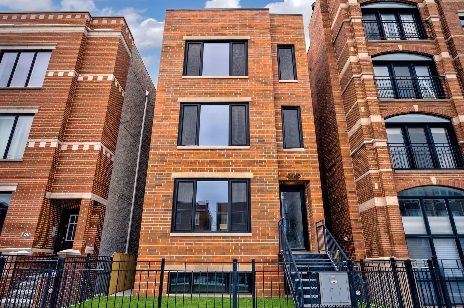 Welcome to 2448 W Diversey Ave. Nearly 3,000 square feet of beautifully designed living space gives this 4-bedroom, 2.5-bath home the scale and feel of a single-family residence. Built in 2022 and barely lived in, the home offers expansive living and huge entertaining spaces, high ceilings, wide-plank hardwood floors, and an open, modern layout filled with natural light. The main level features a spacious living and dining area along with a beautifully appointed kitchen featuring generous cabinetry, a large island, a premium Bosch appliance package, and plenty of room for everyday living and entertaining. Four well-proportioned bedrooms provide flexibility for guests, a home office, or growing families. The exceptionally spacious lower level is bright and open, with large windows and impressive ceiling height, creating comfortable additional living space. Outdoor space extends the living area outside, while garage parking adds everyday convenience. Ideally located near Logan Square, Roscoe Village, dining, shopping, Costco, Target, Midtown athletic club, parks, and transportation.