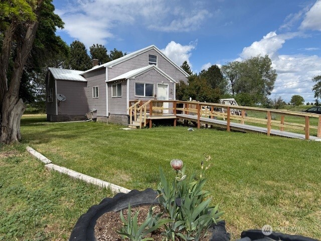 Charming farm on 20.07 acres with 19 irrigable acres, QCBID water rights. 3br, 1ba farm house built in 1915. 1440 sqft shop with office, lean to for equip storage. 450 sqft animal barn. Front pasture is fenced and cross fenced with hot wire. Former riding arena. Greenhouse and chicken coop. RV electrical hookup. Handlines and wheel lines, garden area, fruit trees. Full RV hookups that was previously had a single wide that has since been moved.