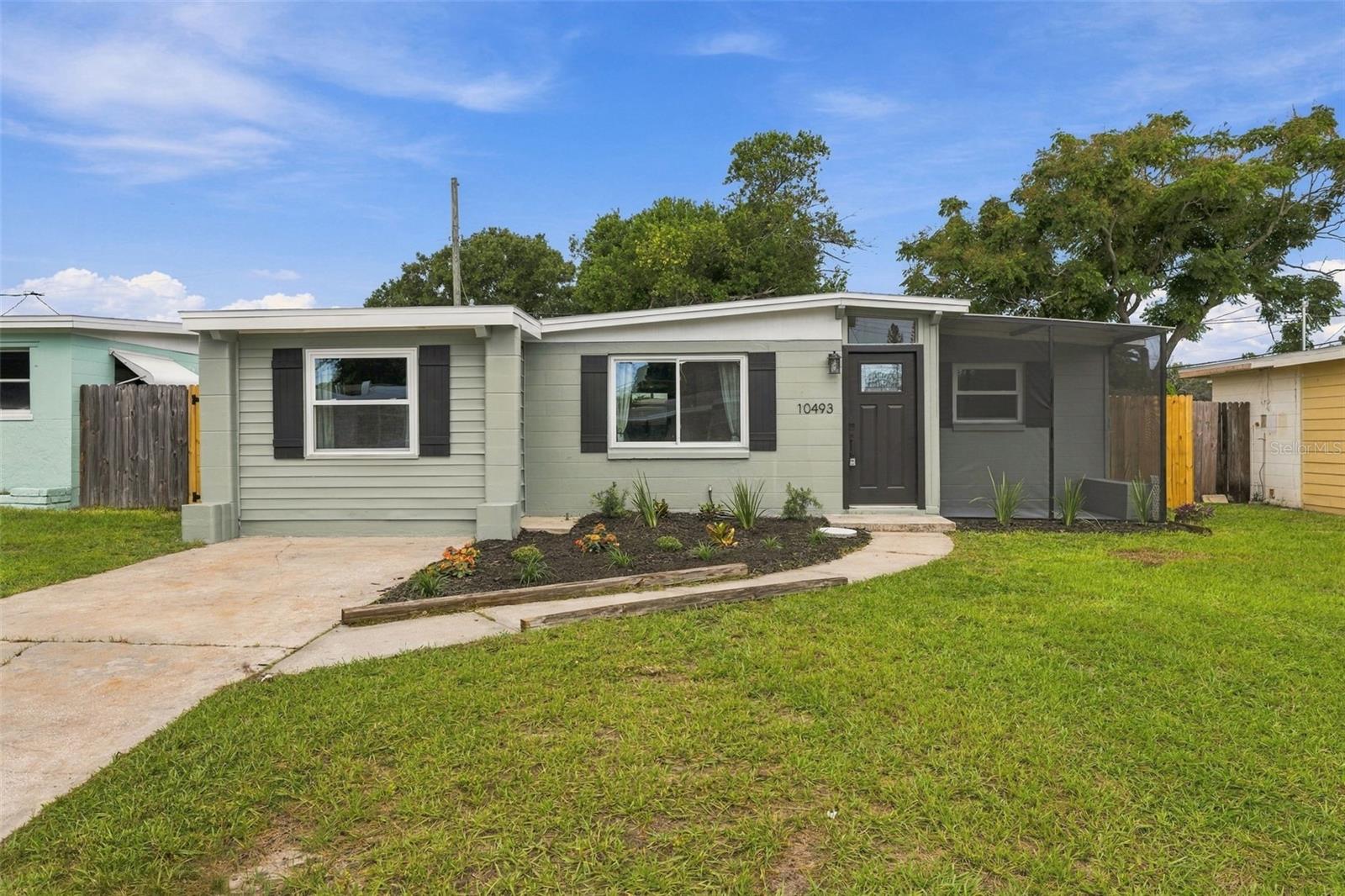 FULLY REMODELED & MOVE-IN READY in the heart of Largo! This stunning home has been completely transformed with luxury vinyl plank flooring throughout and a gorgeous new kitchen featuring quartz countertops, new shaker cabinets, stainless steel appliances, and a stylish subway tile backsplash. Fresh interior and exterior paint, a brand-new front door, modern ceiling fans, and recessed lighting complete the updates. Step out to the huge screened-in lanai — perfect for entertaining — opening to a brand-new wooden deck overlooking your fully fenced private backyard. Updated bathroom with a beautiful walk-in tiled shower, dedicated laundry room, and fresh landscaping for fantastic curb appeal. Minutes to shopping, dining, parks, and Pinellas County's world-famous beaches. Don't miss this turnkey gem — schedule your showing today!