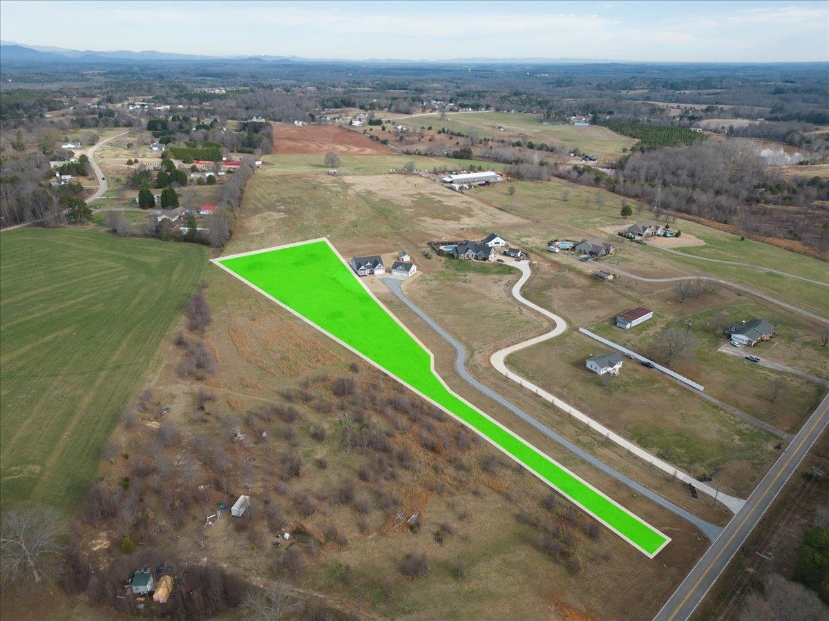 BEAUTIFUL 2.5 Acres in Inman/Campobello area! Lightly Deed Restricted! Mountain Views. Future homesite sits about 600 - 700 feet off the road, where the lot opens up to breathtaking views of pasture, mountains and rolling hills (in all directions)! Right around the corner from Holston Creek Park!  Subject property is currently PART OF a larger parcel, tax map 1-37-00-090.25. Owner is in process of surveying off the approximate 2.5 acres being sold.