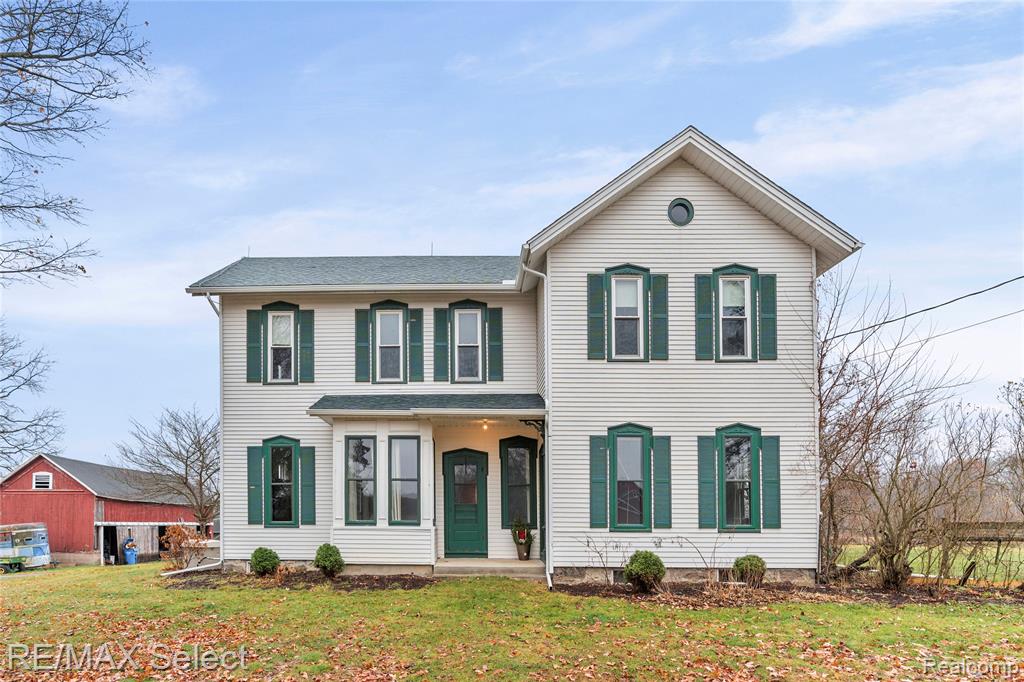 A special piece of Dexter history awaits its next owner. This well-loved farmhouse blends classic character with a flexible layout ideal for modern living. Enjoy 10-ft ceilings, original honey pine and oak floors, and abundant period charm. The spacious kitchen/family room with a cozy gas fireplace anchors the home, while the first floor also includes a primary suite, laundry, living room with alcove, den/optional bedroom, sunroom, and two full baths. Upstairs offers three bedrooms, a full bath, and a large playroom. Outside are multiple outbuildings perfect for storage, animals, or future projects. Updates include central AC, updated plumbing and electrical, fresh paint, and a whole-home generator. Nestled on 5 acres, the property is bordered by conservatorship land across the street and on one side—ensuring protected views, privacy, and no future development.