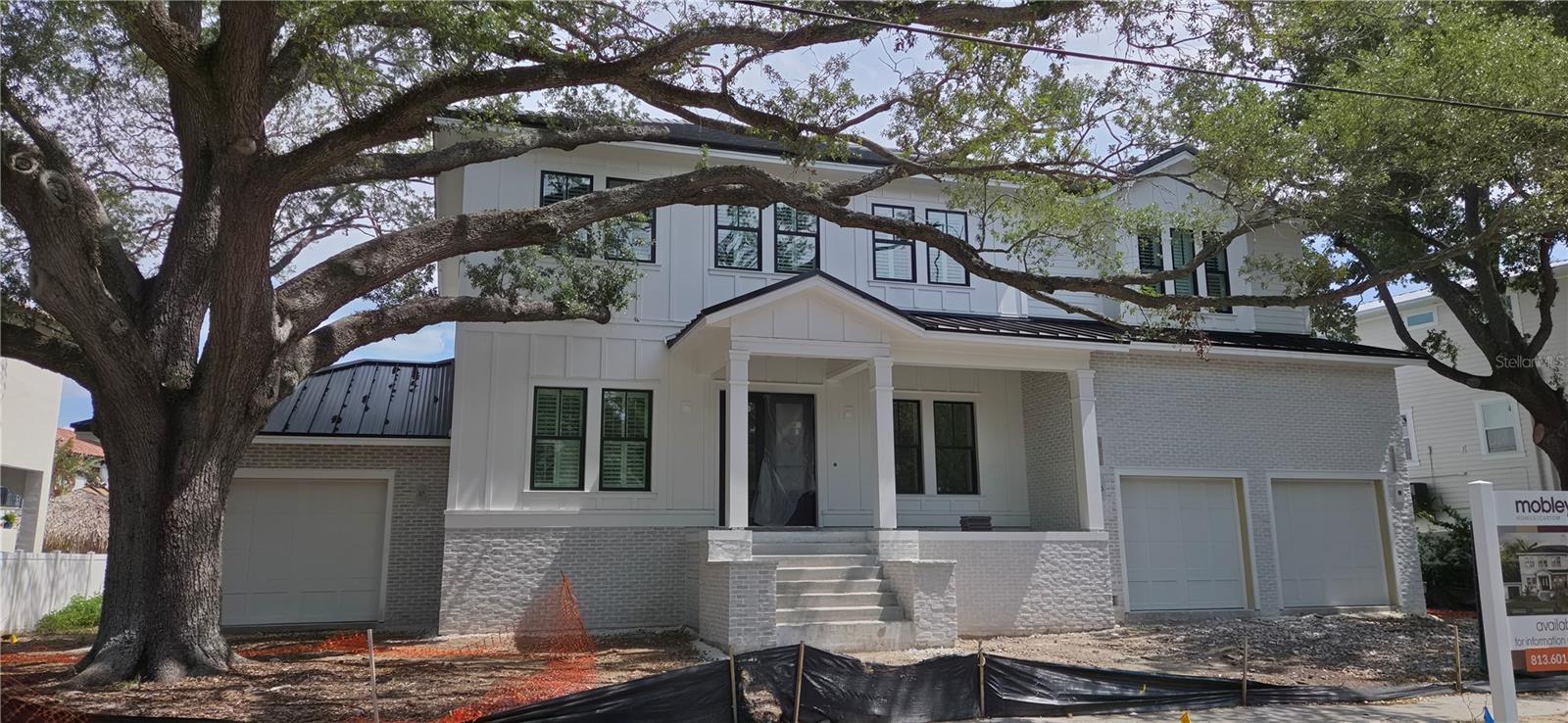 Under Construction. New waterfront Davis Islands Home with 5 bedrooms, 4.5 baths, plus a den and a loft. Top quality workmanship and attention to detail, including but not limited to new dock with covered boat lift, newly dredged area around dock, and lowering platform, wood floors throughout, high ceilings, open floor plan, hardwood floors, upgraded tiles, heavy trim package, gourmet kitchen with large island, Inset cabinets, Marble/Quartz countertops, custom Wolf/Subzero appliances, large walk-in closets and much more. Bring your boat and start living the Islands lifestyle! Located on beautiful Davis Islands, not too far from the walking and bike path, and just a short distance away from Davis Islands Village with many restaurants, shops, and bars. Bring your golf cart and enjoy the Island lifestyle with walking/biking paths, baseball fields, public tennis courts, public historic pool, two dog parks (one wet and one dry), a beach, public marina, and an airport. Located only minutes from Downtown Tampa, Water Street, Sparkman Wharf, and the Tampa Riverwalk, this neighborhood is the most desired in South Tampa!