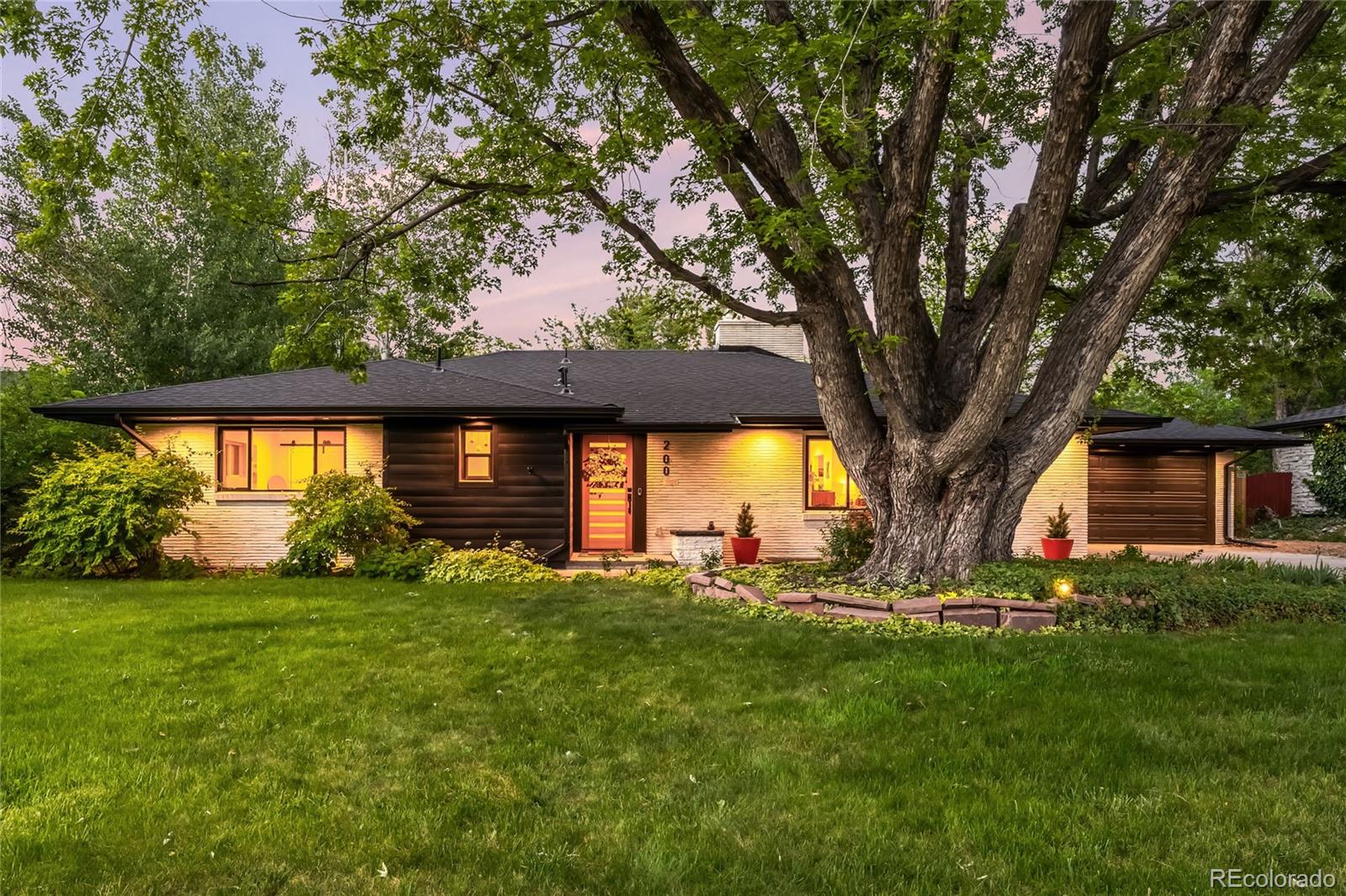Steeped in an enviable locale on a 11,400 foot lot in the exclusive Crestmoor Park filing 2 with the highly sought after pool & tennis club, this turnkey mid-mod ranch won’t last long. Step onto a spacious front porch that lends a warm welcome into this fully renovated home. Flooded with natural light and large windows, the living space has flawless livability with hardwood floors, stylish finishes, a fireplace and timeless design. The open living space flows seamlessly into a chef’s kitchen that features high-end Bosch appliances, quartz countertops w/ seating for 5+, custom lighting and shaker cabinets. Enjoy easy access from the kitchen and dining space to the flourishing back stone patio via the expansive mudroom with built-ins. The outdoor oasis showcases multiple seating areas, a built-in gas grill w/ counter seating and a sprawling yard – a true entertainer's or gardener’s dream. Back inside the home, the primary suite beckons peaceful rejuvenation with a dual vanity, custom shower and a walk-in closet that will comfortably fit the all-season wardrobes for two. The main floor also includes a sunny second and third bedroom + another full bath showcasing chic finishes. The fully-finished lower level plays host to a large living space w/ a fireplace, cabinets, wet-bar, two additional bedrooms, a full bathroom, an expansive laundry room and multiple storage closets. Relish in the convenience of all updated systems, an abundance of privacy, an oversized, attached 2-car garage, mature landscaping, automatic irrigation and a storage shed. With easy access to all of your favorite parks, restaurants, & shops just seconds away, this exceptionally rare opportunity awaits.