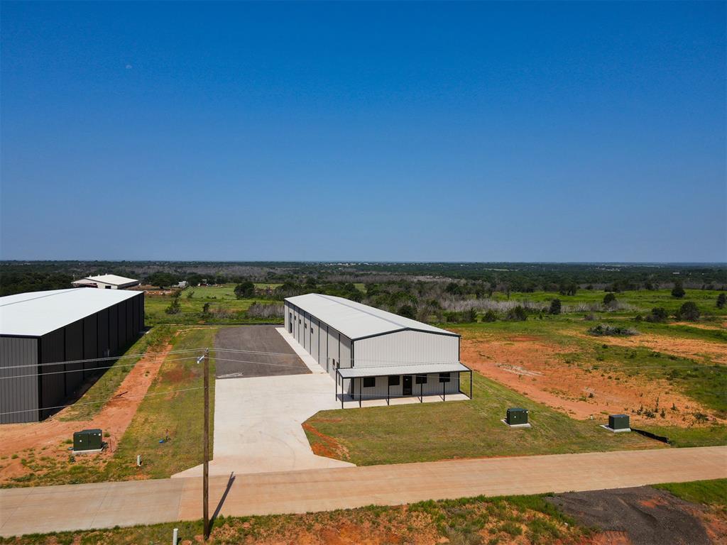This 8,000 SqFt building for rent in Edmond, OK is located in the newly-built Koloa Industrial park. Conveniently situated off Sooner Road & Charter Oak Road just west of I-35, this building is equipped with a well & septic system, 3-phase 400 amp electrical, and two large garage doors so you can easily access and transport equipment or goods for storage or export. This building also features 21' tall ceilings and spray foam insulation, ensuring comfortable and energy-efficient use.

We are offering Owner Financing on this property for only a 10% downpayment. If you decide to finance with us there are NO credit checks, early payoff penalties, or hidden fees! We also welcome third-party financing and cash offers.

-1.00 Acre Lot
-8,000 SF building
-21' Ceilings
-3-Phase 400 Amp Electric to Building
-2 Overhead Garage Doors – 1 side and 1 back
-Closed Cell Spray Foam Insulation
-Well & Pressure Tank
-Septic
-Natural Gas at the property
-Fiber at property