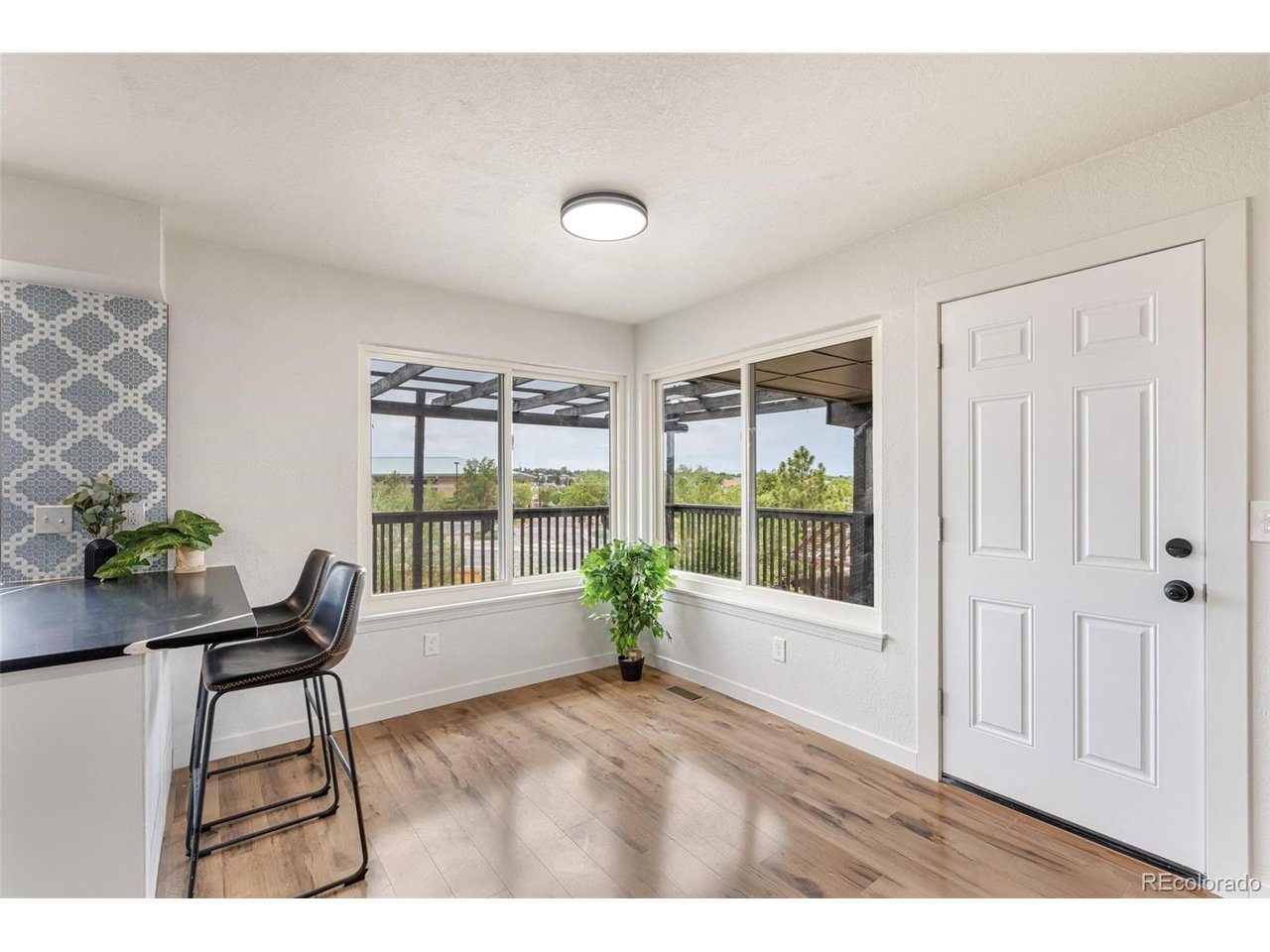 Welcome to this beautifully updated home offering more than 3,000 sq ft of living space on an expansive over 16,000 sq ft fenced lot with walkout basement and NO HOA! This unique property features 6 bedrooms, 4 bathrooms, 3 living rooms, 1 laundry areas, and an attached 2-car garage, providing exceptional flexibility for large families, multigenerational living, or house hacking. Step inside the main level to discover brand-new luxury vinyl flooring, fresh paint, and a stylish, fully renovated kitchen with quartz countertops, modern backsplash, and stainless-steel appliances. The open layout creates an inviting space perfect for everyday living and entertaining. Upstairs, you'll find 3 bedrooms and 2 full bathrooms. The primary suite features a full bathroom and a walk-in closet. The finished walkout basement expands your possibilities even further with 3 bedrooms (2 non-conforming bedrooms), 1 full bathroom, a spacious living area, and a wet bar featuring new cabinetry and quartz countertops. New carpet throughout the basement adds comfort and warmth. Outdoor enjoyment awaits in the fully fenced backyard, ideal for entertaining, gardening, or relaxing. Located just minutes from major highways, shopping, dining, and entertainment options-this home offers the perfect blend of space, comfort, and convenience. Schedule your showing today