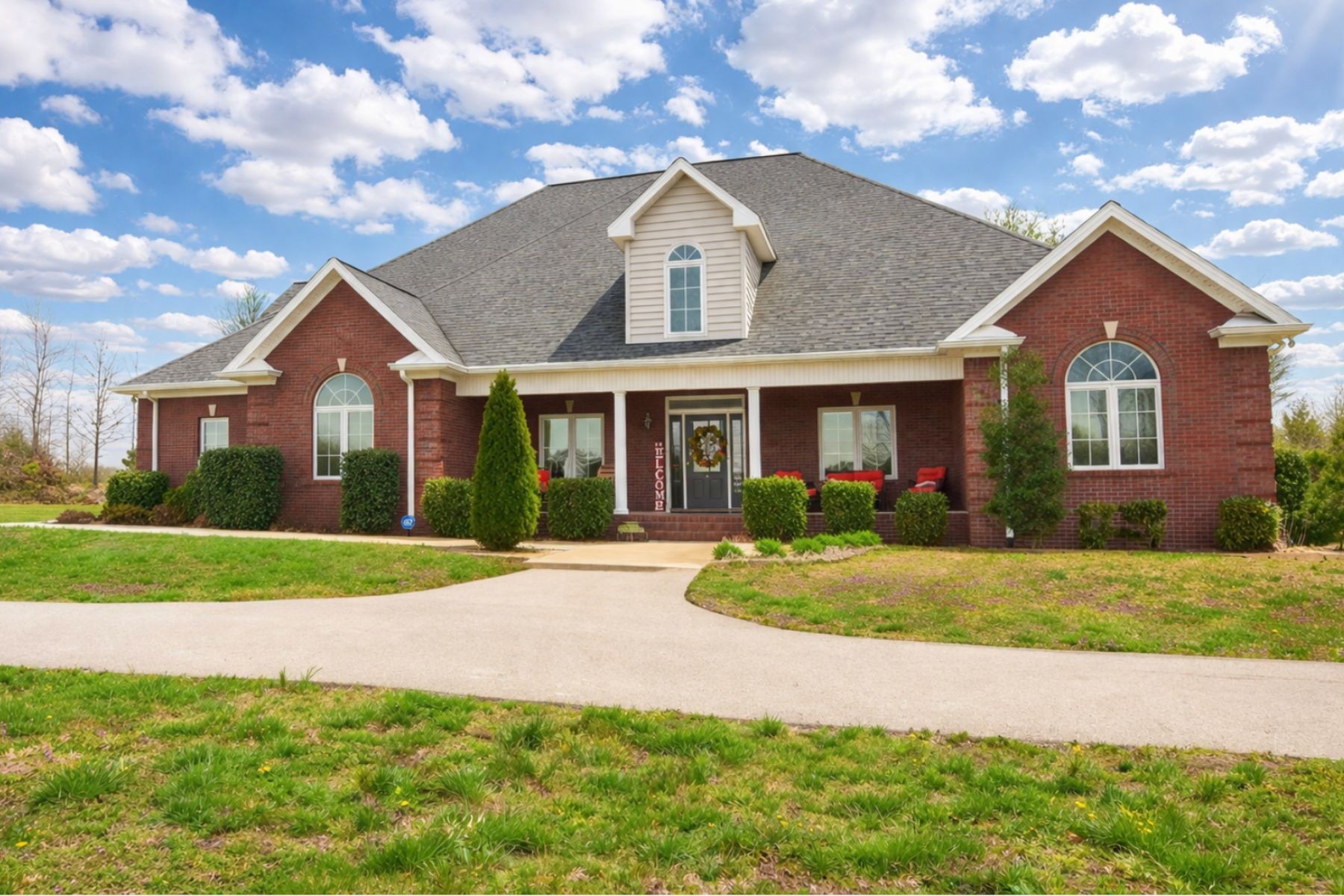 Stunning executive brick home set on nearly 3 private acres, offering space, efficiency, and thoughtful design throughout. This 5 bedroom, 5 full bathroom home features a functional layout with room to live, work, and entertain.The main level showcases heated ceramic tile floors powered by an energy-efficient electric tankless water heater, creating both comfort and long-term efficiency. The open concept living area is anchored by a beautiful stone fireplace, flowing seamlessly into a fully equipped kitchen with granite countertops, gas range with hood, built-in oven, ice maker, wine cooler, and ample cabinetry. Formal and casual dining spaces provide flexibility for everyday living and hosting.The primary suite offers a spacious retreat with a spa-like feel. Additional bedrooms are well-sized, and a bonus room provides added flexibility for a home office, media space, or guest accommodations. Hardwood flooring carries throughout the second level.Outside, enjoy privacy along with a 30x40 shop.  The property also includes a 1,000-gallon owned propane tank. Fireplace and stove are connected to propane.  Scenic views are enhanced by a Vineyard located just across the street.This property offers a rare blend of space, functionality, and efficiency in a peaceful setting.