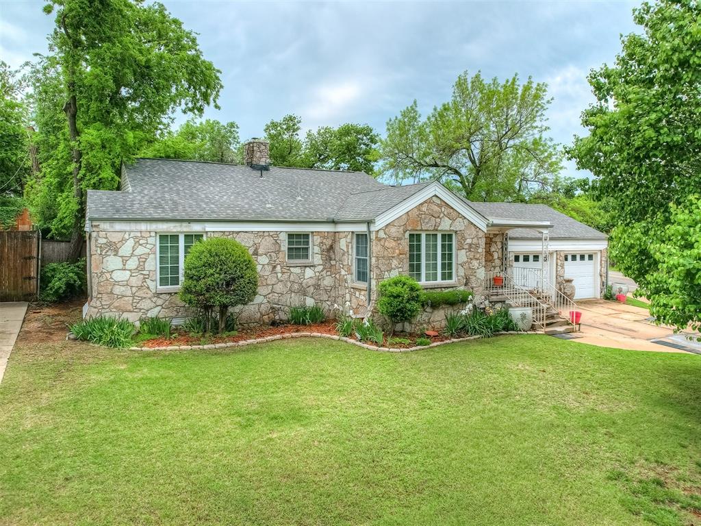 **Rare opportunity in Douglas Place/Edgemere Terrace to own a spacious home on 3 LOTS! The house is perfectly situated on a corner lot with a circle drive. This charming stone bungalow has 3 living areas plus a sunroom/office. The hardwood floors are in great condition! The hall bathroom has been updated as well as the kitchen and applicances. Hard to find 2 CAR ATTACHED GARAGE! There is a tankless water heater too! Windows have also been updated within the past few years. The location is perfect within blocks of great Western Ave Restaurants, Parks and Shopping! Short drive to Whole Foods, Trader Joes and Classen Curve. Easy access to Highways makes commuting a breeze!! You can get to Downtown OKC, Tinker Air Force Base, OU Health Science Center and more with ease. The house has been lovingly landscaped with a myriad of blooming flowers and plants that keep it beautiful year round! The huge backyard provides serenity with tall privacy fencing all the way around.