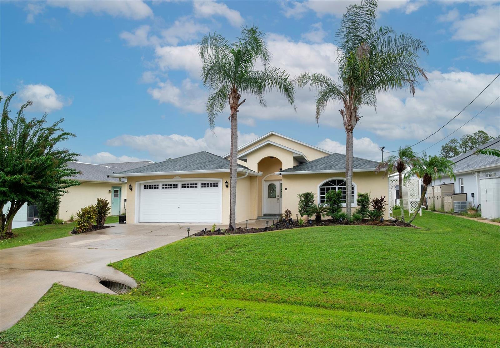 Experience the Florida waterfront lifestyle in this 3 bedroom, 2 bath split floor plan home located near the end of a quiet saltwater canal in Palm Harbor. Offering 1,631 square feet of living space, 60 feet of bulkhead and a private boat lift, this home features high ceilings, arched openings, rounded corners and abundant natural light. Sliding glass doors from the primary bedroom, living area and additional bedroom connect the interior to the waterfront setting. The kitchen features granite countertops and flows naturally into the main living areas. outside, enjoy peaceful canal views and direct access to Palm Coasts, waterways. Additional features include an HVAC system updated in 2021, epoxy coated garage flooring and a tucked away laundry area. Linear Park is nearby, along with convenient access to shopping, dinning and all that Palm Coast has to enjoy.