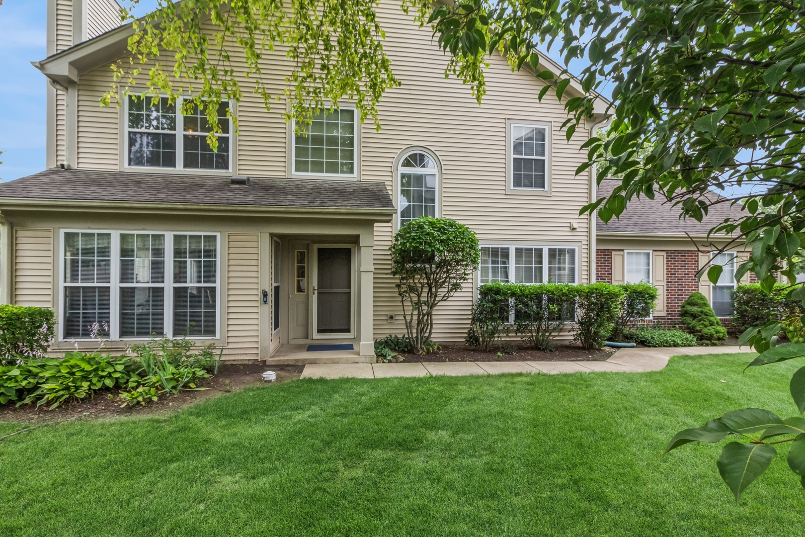 Welcome to this charming 3-bedroom, 2.5-bath end-unit townhome with an attached 2-car garage and located in the desirable Cobblers Crossing community of Elgin. The Benton model is the largest townhouse by square footage & offers the added benefit of a private entrance unlike other units that share a front porch with a neighbor. The main level features both a cozy family room and a warm, inviting living room with a gas fireplace-the focal point of the space-surrounded by an abundance of natural light. The kitchen includes all appliances and a convenient butler's pantry, offering extra counter space and storage, and flows seamlessly into the dining area, perfect for entertaining. Upstairs, you'll find 3 bedrooms and 2 full bathrooms. The master suite boasts his-and-her closets, including a walk-in, along with a private ensuite featuring a double vanity, large soaking tub, and separate shower. Step outside to enjoy your private patio, surrounded by mature trees and beautifully landscaped grounds. Take advantage of the nearby walking paths, scenic pond, and the convenience of being close to grocery stores, restaurants, and schools. Don't miss this opportunity-schedule your private showing today!