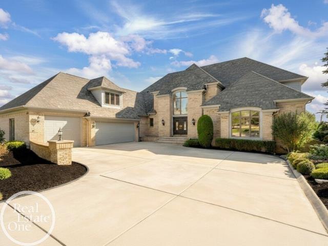 Welcome to this stunning 1.10-acre riverfront estate on the St. Clair River! Offering breathtaking views and exceptional living, this one-of-a-kind home combines elegance, space, and lifestyle. Step inside to a grand main level featuring a spacious living room with a fireplace, built-in bar, and floor-to-ceiling windows showcasing panoramic river views. The gourmet kitchen is perfect for entertaining and flows seamlessly onto a large deck overlooking the water. A generously sized home office adds flexibility for today's lifestyle. The finished walkout lower level is an entertainer's dream, complete with a second kitchen, fireplace, and indoor jacuzzi-ideal for guests or extended living. Upstairs, you'll find two primary suites, including an impressive executive closet spanning over 500 sq ft. Located within walking distance to downtown St. Clair and the Palmer Park boardwalk, this property offers the perfect blend of privacy, luxury, and convenience.Rare opportunity-riverfront living on over an acre!