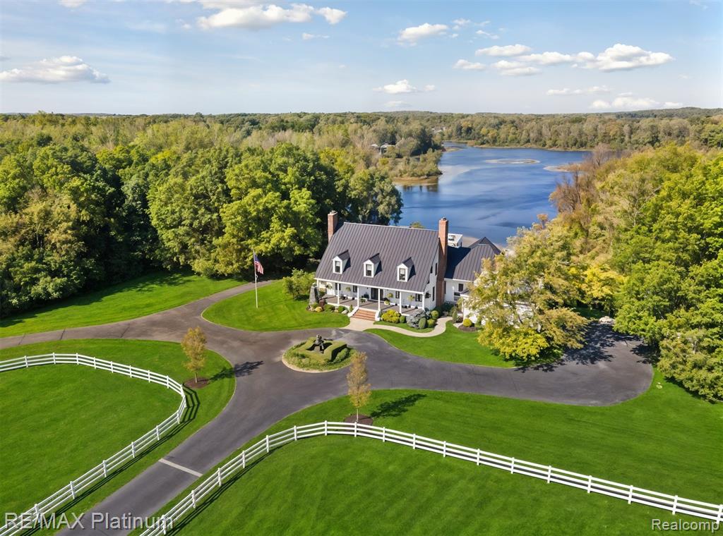 Spectacular waterfront estate! Live a life of luxury and leisure in this exquisite homestead, as soon as you pull through the gate and down the circular driveway you will never want to leave.  Cape cod syle with black metal roof and all new Pella black framed windows gives stunning views to the lake, along with new trex on multiple decks.  The private boat house with sundeck on top & gazebo will take your breath away with easy access to the sand beach and dock.  All the work is done on this secluded property on over 18 acres!  Bring the animals as it includes a 5 stall horse stable, 2 paddocks, tack room, pastures & heated dog kennel for the fur babies. This property offers a rare opportunity to own a piece of paradise! 5 bedrooms all with attached baths. In-Law/Nanny/Caretaker suite with its own private kitchen, sitting room, full bath & bedroom with a separate entrance that can be locked off from the rest of the house. Walk out lower level is an entertainer's dream it includes a theater with seats for 20, billard area, kitchen with bar seating and a wet bar with seating.  Hot tub room is also on this level when you come in off the lake along with a full bath.  The basement (yes, another level down from the walk-out) features a gym with professional equipment, a wine celler, a massive storage area and a craft/hunting room.  This home is a MUST SEE IT TO BELIEVE IT, to much to list in words.  Make your showing appointment today. BATVAI