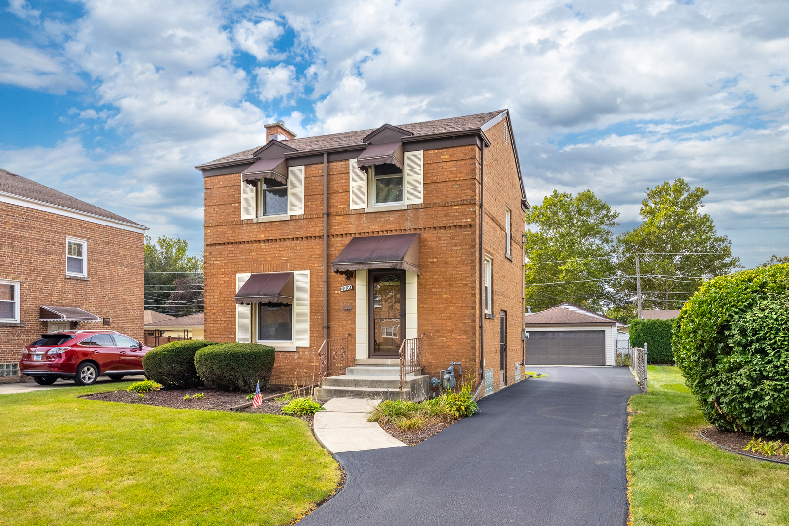 Welcome to this beautifully maintained all-brick Baltis Georgian, perfectly situated on a peaceful, tree-lined street in South Westchester. From the moment you step inside, you'll feel the warmth, coziness, and tranquility that make this home so inviting.    The interior has been lovingly cared for and thoughtfully updated, featuring newer windows, flooring, and custom touches throughout. The kitchen showcases rich, handcrafted oak cabinets, and the separate dining room provides the perfect setting for family dinners or friendly gatherings.    Upstairs, you'll find spacious bedrooms, including a generous primary suite with a walk-in closet. The home is equipped with modern essentials such as an overhead sewer system, sump and ejector pumps, a newer water heater and furnace, and solid copper plumbing throughout offering peace of mind for years to come.    Outside, the property features architectural shingles, a long driveway leading to a 2-car garage, and a lovely backyard filled with colorful flowers perfect for relaxing or entertaining.    You'll also love the location, just minutes from major expressways, commuter trains, schools, parks, and shopping. Enjoy nearby favorites like Mayfair Center, forest preserve trails, tennis courts, golf courses, and the world-class Oakbrook Center Mall.    This is the kind of cozy, well-cared-for home that radiates pride of ownership and it shows.