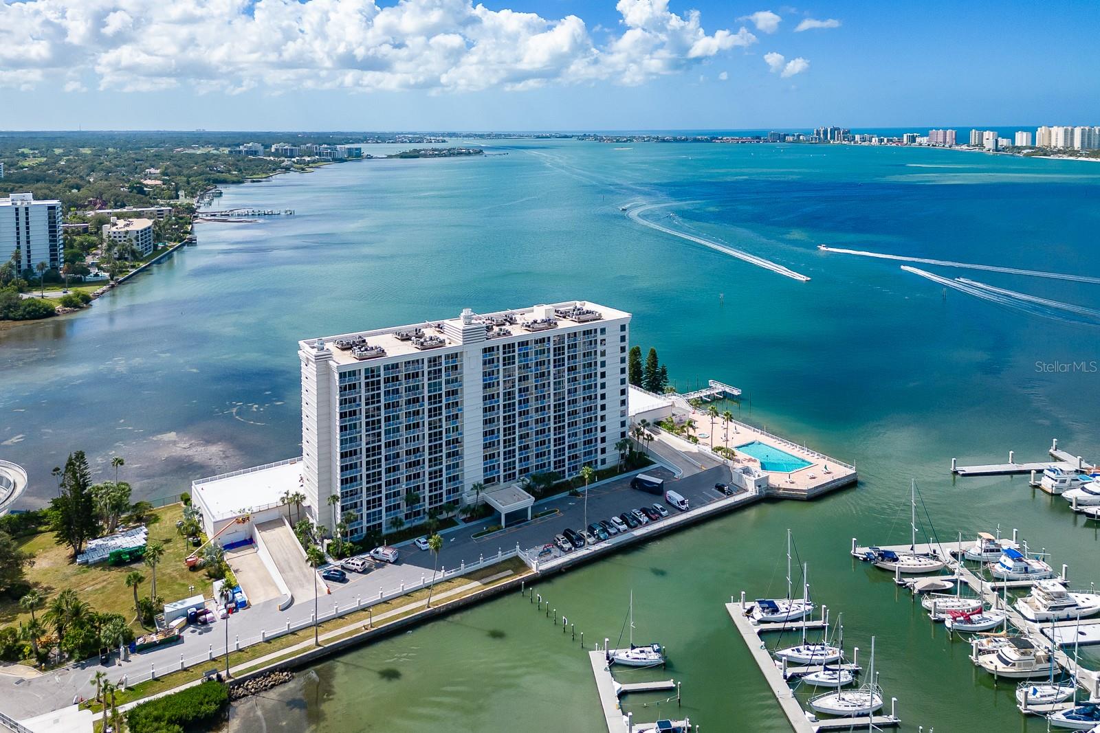 Take Advantage of This Rare Waterfront Opportunity at 100 Pierce — Where Paradise Truly Meets Home.  Welcome to an extraordinary, one-of-a-kind residence offering over 2,100 square feet of refined coastal living in one of Clearwater’s most coveted waterfront communities. This expansive 3-bedroom, 3-bathroom condo is a rare find—complete with two reserved under-building parking spaces and breathtaking, unobstructed views of the Intracoastal Waterway.  From the moment you enter, you’re captivated by floor-to-ceiling windows that flood the home with natural light and showcase sweeping panoramic water views from nearly every room—including all three bedrooms, the living area, and dining space. Two oversized balconies stretch the full length of the residence, creating a seamless indoor-outdoor lifestyle and offering a front-row seat to dolphins at play, passing boats, vibrant sunsets, and dramatic coastal skies.  Designed for both comfort and entertaining, the open-concept floor plan features a massive living room, a generous dining area that easily accommodates gatherings, and a spacious kitchen with abundant custom cabinetry and an oversized breakfast bar that functions like a true island centerpiece.  The primary suite is a private retreat, complete with custom built-ins, a well-appointed ensuite bath, and stunning water views to wake up to each morning. A second ensuite bedroom offers added privacy and its own balcony access, while the third bedroom is impressively large—perfect for guests, a home office, or flexible living space.  Additional highlights include:  New flooring throughout the living, dining and primary suite.  Two coveted covered parking spaces (ground level). Private storage unit.  Dedicated laundry room just steps away.  Residents of 100 Pierce enjoy resort-style amenities, including:  Heated waterfront pool & spa, expansive sun deck and grilling area, waterfront picnic spaces and fishing pier, kayak/paddleboard launch with dedicated storage (“Board Room”), on-site storage with bait fridge and fishing gear space. Ideally located next to the city marina and the newly reimagined waterfront park, The Sound, you’re just steps from concerts, events, green space, and stunning harbor views. Enjoy walkable access to downtown Clearwater’s vibrant dining, shopping, coffee spots, and the historic Capitol Theatre. Take a short bike ride on the Pinellas Trail to Dunedin—or head just minutes away to the world-renowned white sands of Clearwater Beach.  Opportunities like this are exceptionally rare. Experience the scale, views, and lifestyle that set this residence apart.Schedule your private showing today and step into waterfront living at its finest.