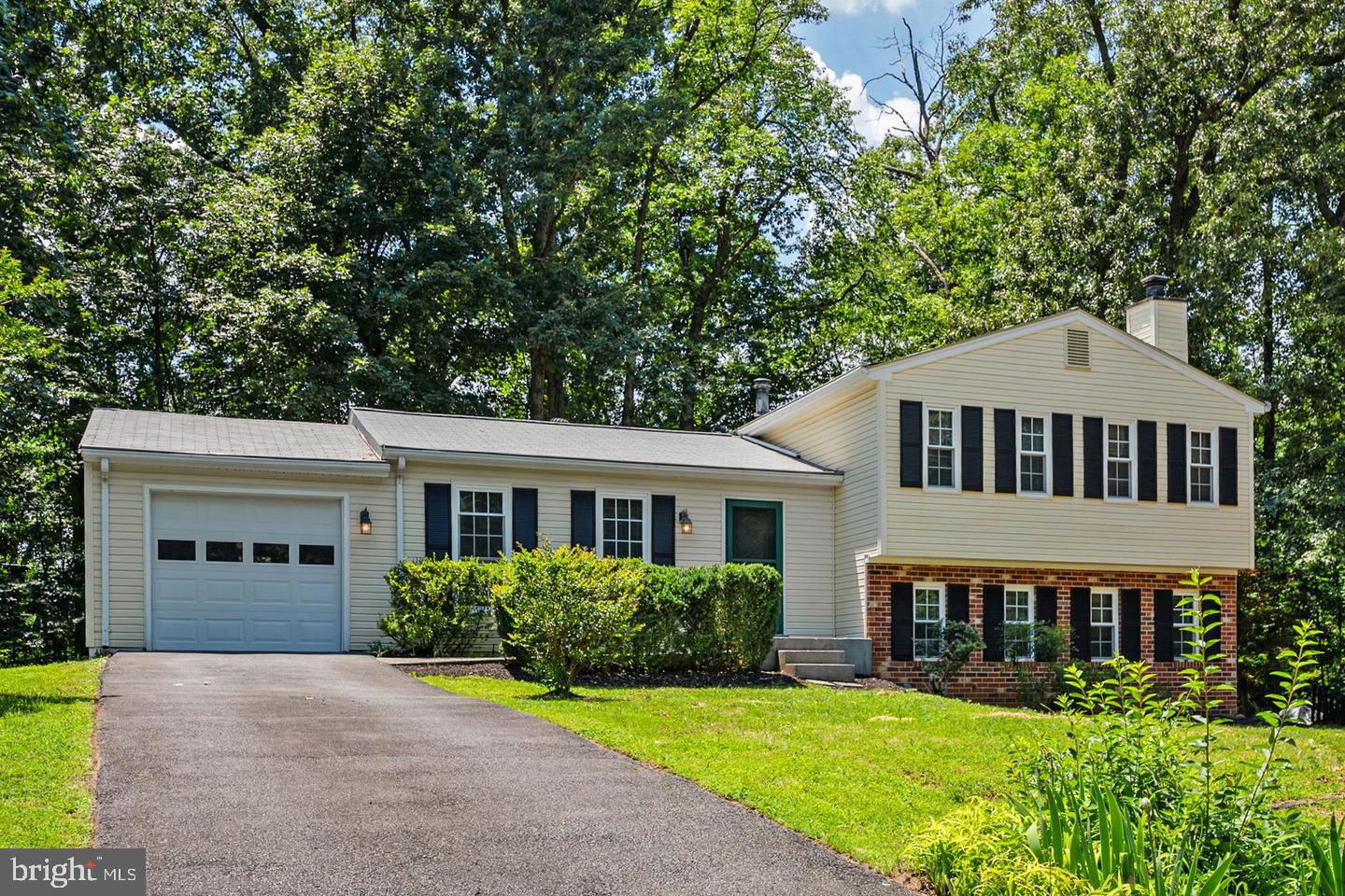 Mid-Century Modern Charm meets the ultimate Reston lifestyle! Nestled on a wooded lot in the highly sought-after Stratton Woods community, this captivating multi-level residence features 3 bedrooms, 2 full bathrooms, and 1 half bathroom. The main level welcomes you with beautiful hardwood floors, a freshly painted interior, and a striking, remodeled open-concept kitchen complete with granite countertops and custom cabinetry. Upstairs, the home features a brand-new primary bathroom, offering a fresh and private retreat.The versatile floor plan provides incredible flexibility, featuring a finished basement complete with a cozy wood-burning fireplace, a convenient half bathroom, and a generous laundry and storage space. Outside, the property is a private haven perfect for weekend barbecues, gardening, or simply unwinding under a serene canopy of mature trees.Residents enjoy access to Reston’s extensive network of walking and biking trails, creating an ideal balance of nature and community living. This convenient location places you just minutes from Reston Town Center, Lake Thoreau, South Lakes Village Center, and endless shopping, dining, and entertainment options. Commuters will appreciate the close proximity to Reston Metro stations, Fairfax County Parkway, Route 7, the Dulles Toll Road, and Washington Dulles International Airport. Combining timeless architectural character with key modern updates, this home offers an exceptional opportunity to enjoy the Reston lifestyle—schedule your private tour today!