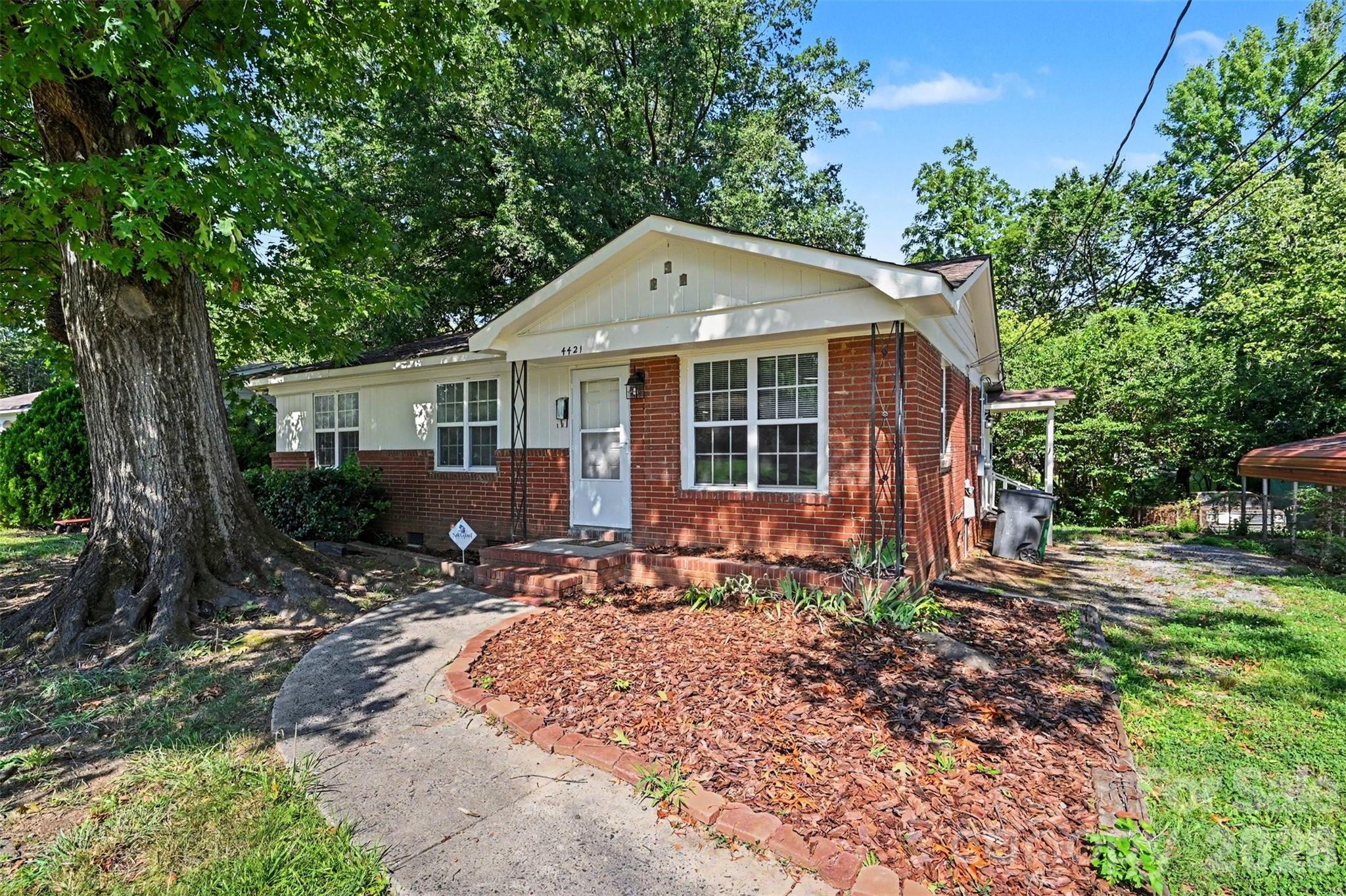 Welcome to this beautifully remodeled ranch home, where timeless charm meets thoughtful modern updates. From the moment you arrive, you'll appreciate the inviting curb appeal with its classic brick exterior, mature shade trees, and spacious yard. Inside, the bright, open-concept layout is filled with natural light and showcases beautifully refinished hardwood floors, fresh finishes, and a seamless flow between the living spaces, creating an inviting atmosphere for both everyday living and entertaining. The stunning new kitchen serves as the heart of the home with its stylish cabinetry, contemporary finishes, and generous workspace, while the updated interior offers comfortable bedrooms and a refreshed bath designed with today's lifestyle in mind. Major improvements, including a new HVAC system, new electrical panel and sub-panel (200 amps), and new water heater, provide added peace of mind, allowing you to move right in and enjoy.The expansive backyard offers endless possibilities for outdoor entertaining, gardening, play, or simply relaxing beneath the mature trees. Ideally located just minutes from Uptown Charlotte, Charlotte Douglas International Airport, I-85, and I-485, this home provides exceptional convenience for commuters while keeping you close to shopping, dining, entertainment, and everyday essentials. Nearby residents also enjoy easy access to Renaissance Park, the U.S. National Whitewater Center, and all that the rapidly growing west Charlotte area has to offer, making this beautifully updated home an outstanding opportunity for homeowners and investors alike.